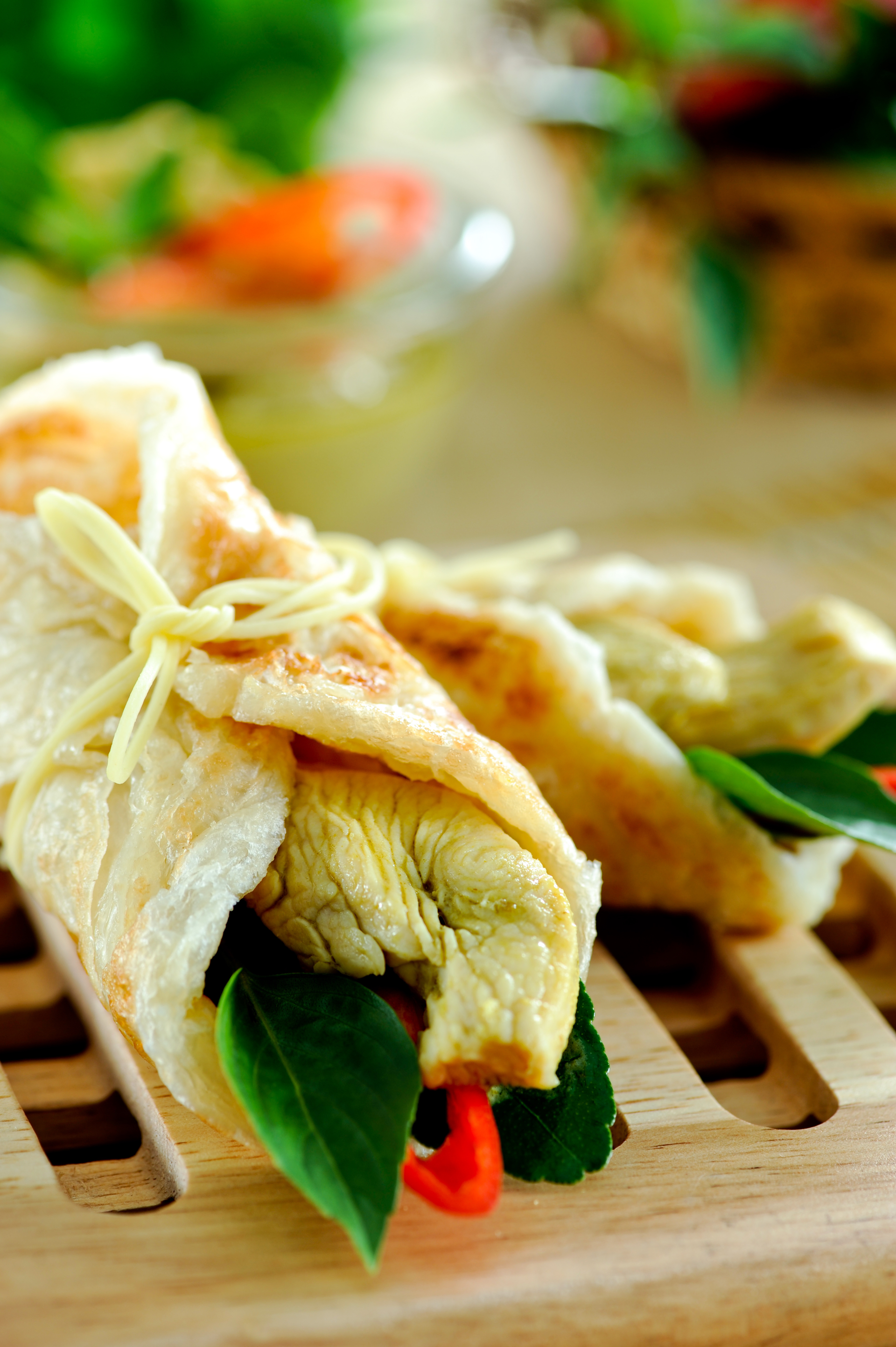Overhead flat-lay of all ingredients for Scented Thai Pandan Chicken Wraps laid out on a kitchen surface.
