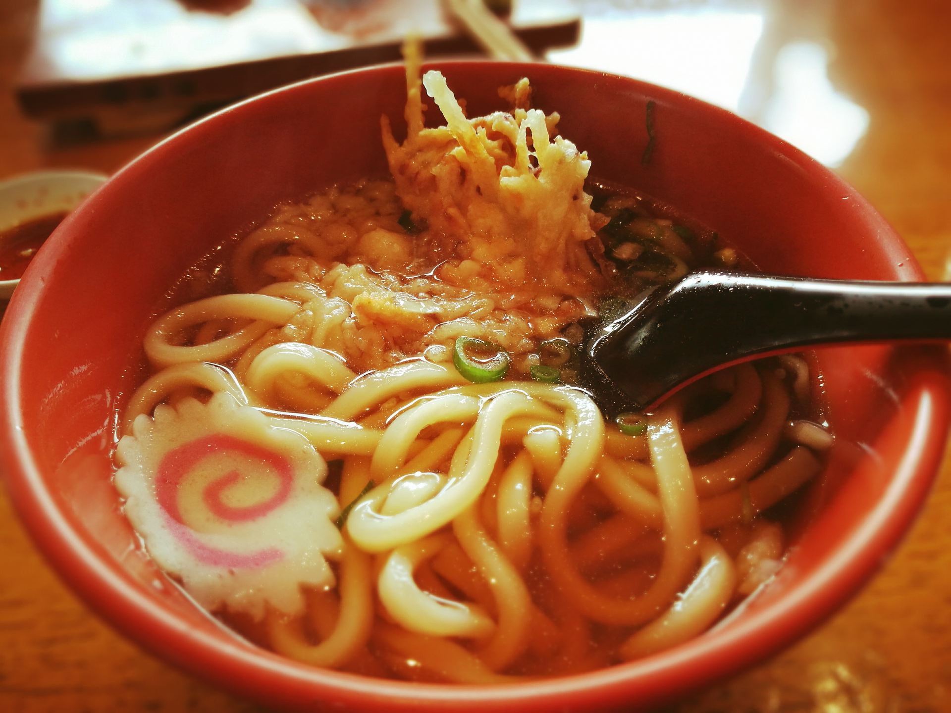 Overhead flat-lay of all ingredients for Silken Japanese Curry Udon with Tempura Shrimp laid out on a kitchen surface.