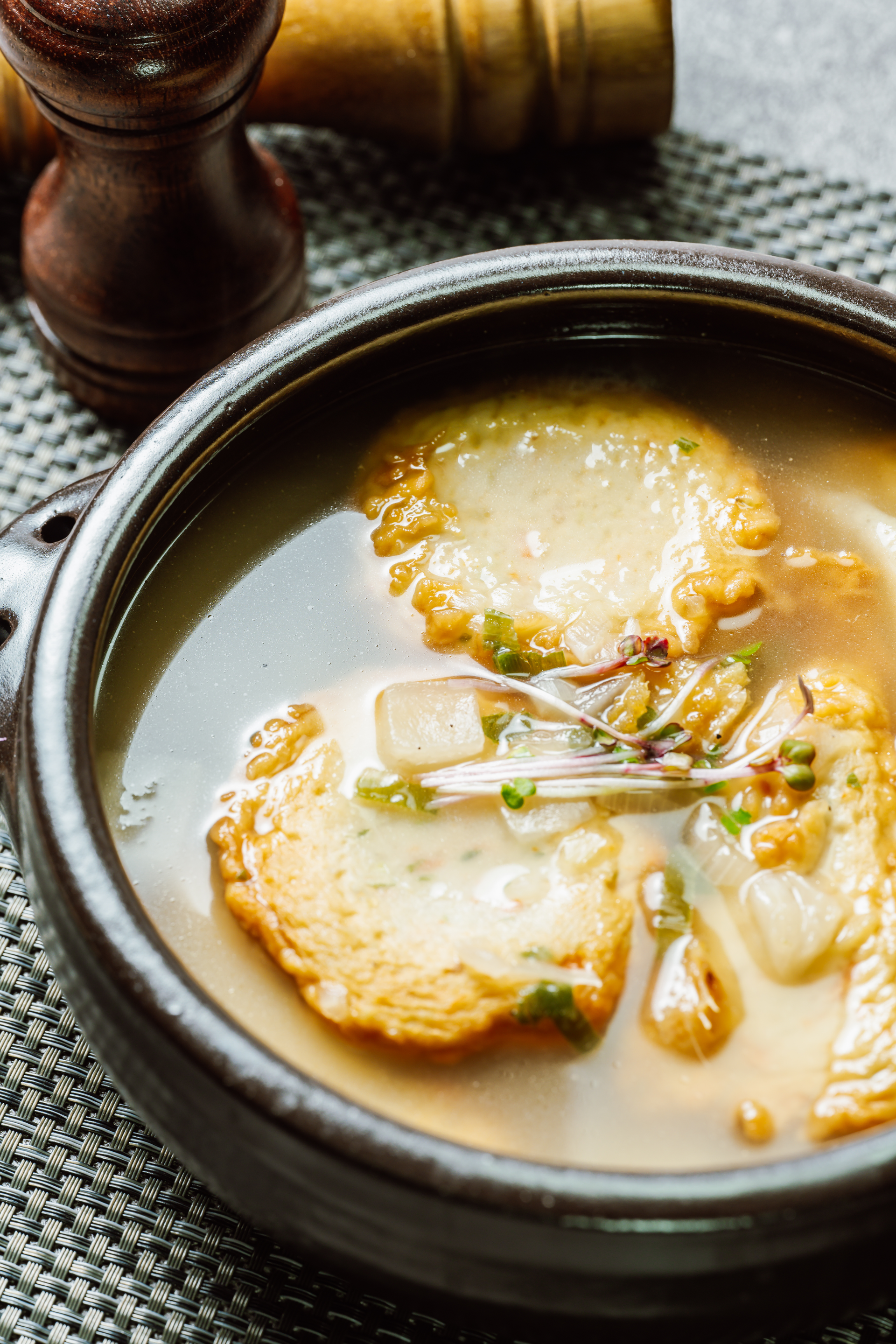 Overhead flat-lay of all ingredients for Silken Japanese Miso Soup with Tofu Tempura laid out on a kitchen surface.