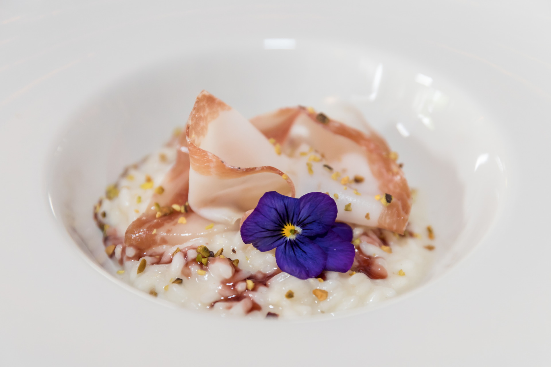 Silken Moroccan Vanilla Rosewater Pudding with Almond Crunch — Dessert served and photographed from above
