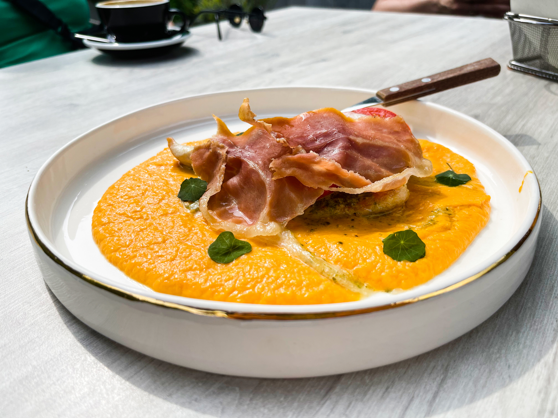 Silken Spanish Iberian Ham Flan with Manchego Sauce — Appetizer served and photographed from above