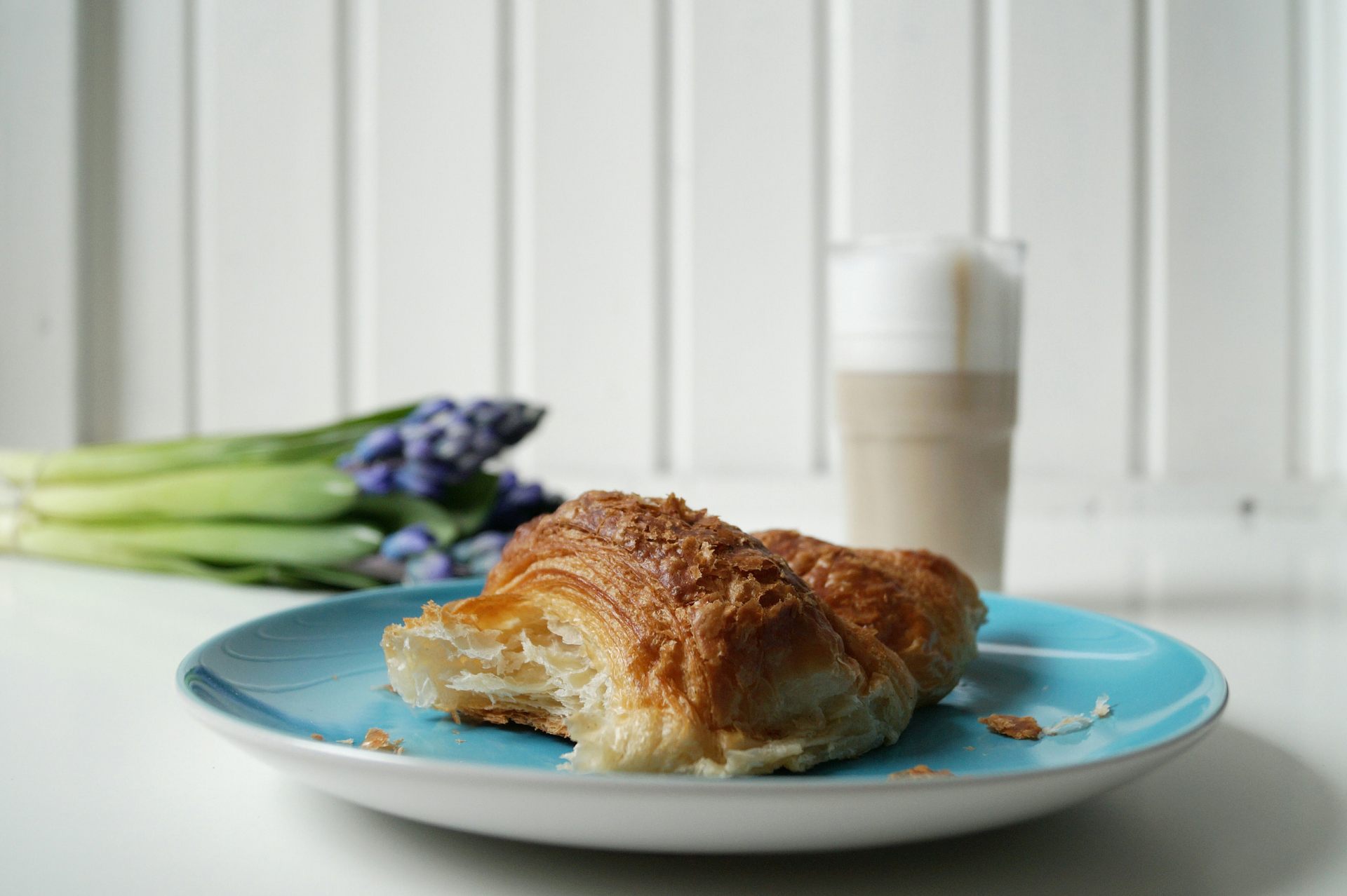 Overhead flat-lay of all ingredients for Silky Greek Galaktoboureko with Semolina Custard laid out on a kitchen surface.