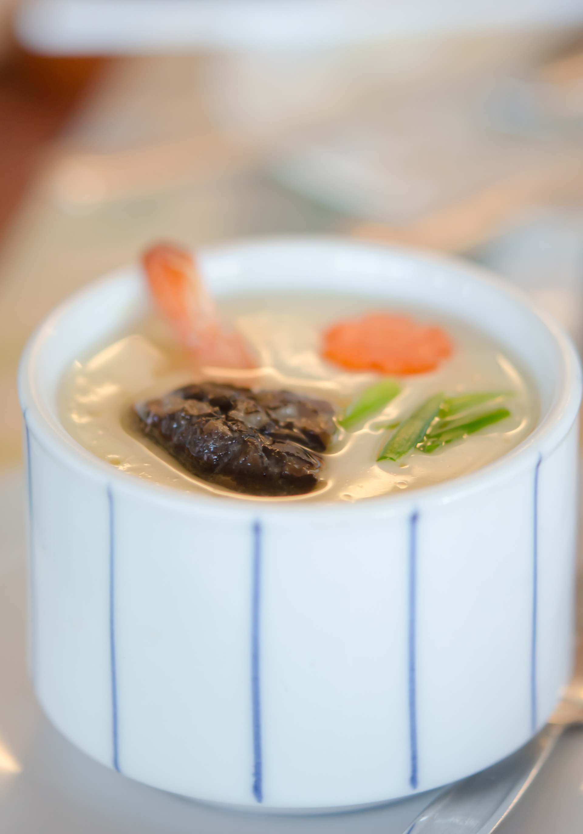 Overhead flat-lay of all ingredients for Silky Japanese Chawanmushi with Shiitake and Dashi laid out on a kitchen surface.