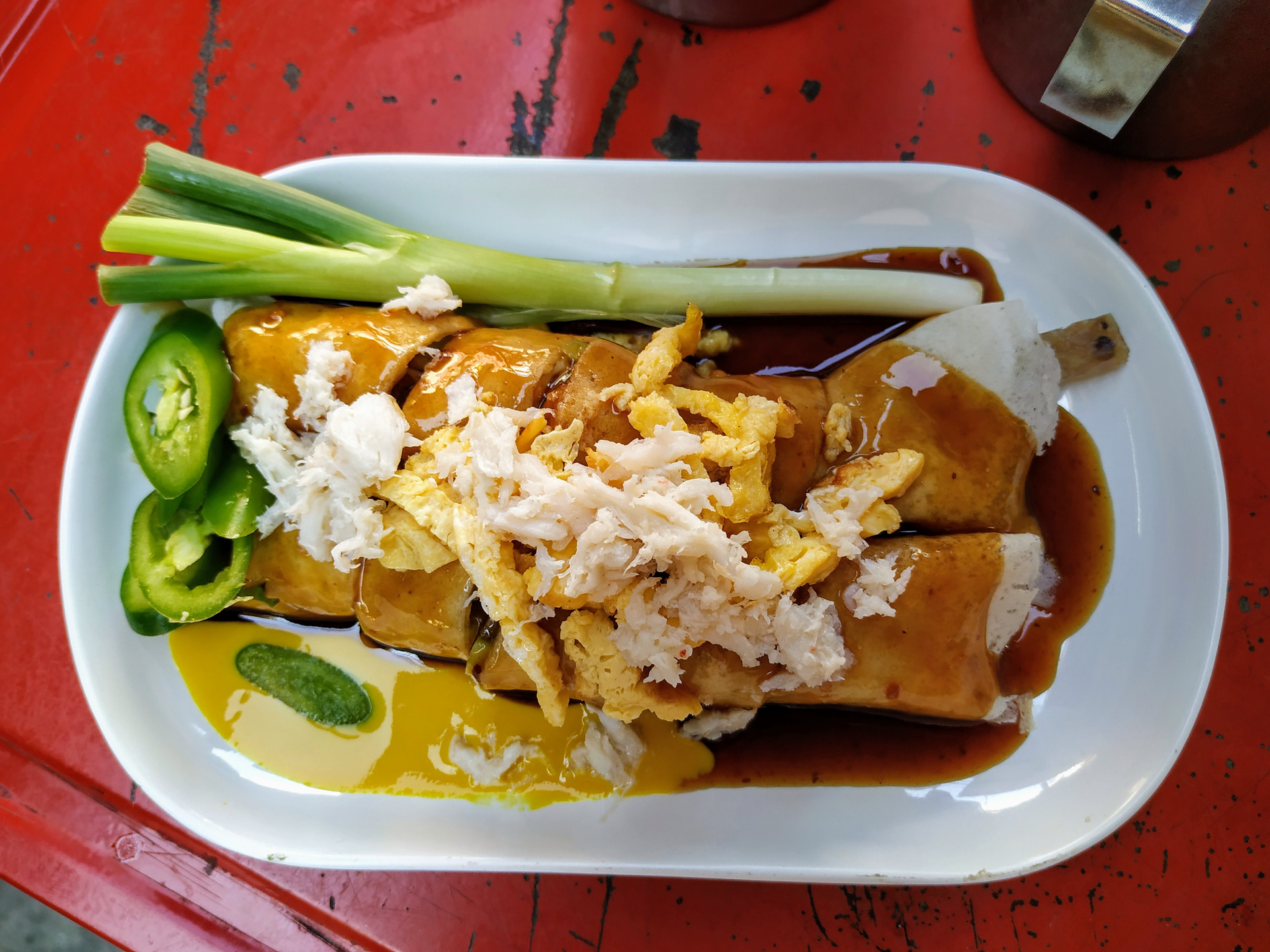 Overhead flat-lay of all ingredients for Silky Peruvian Tripas a la Mode with Huancaína Sauce laid out on a kitchen surface.