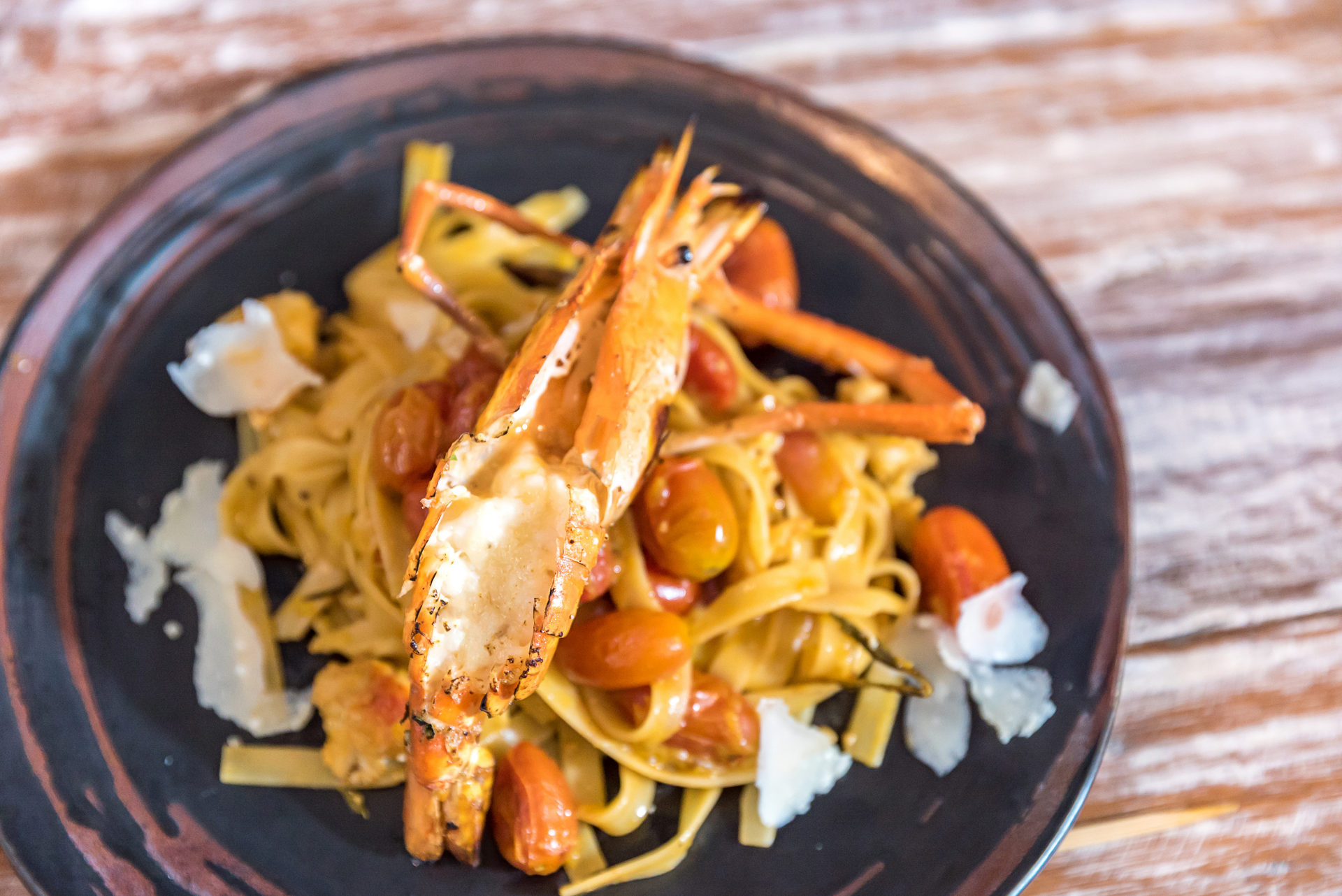 Overhead flat-lay of all ingredients for Singaporean Chili Soft-Shell Crab with Crispy Noodles laid out on a kitchen surface.