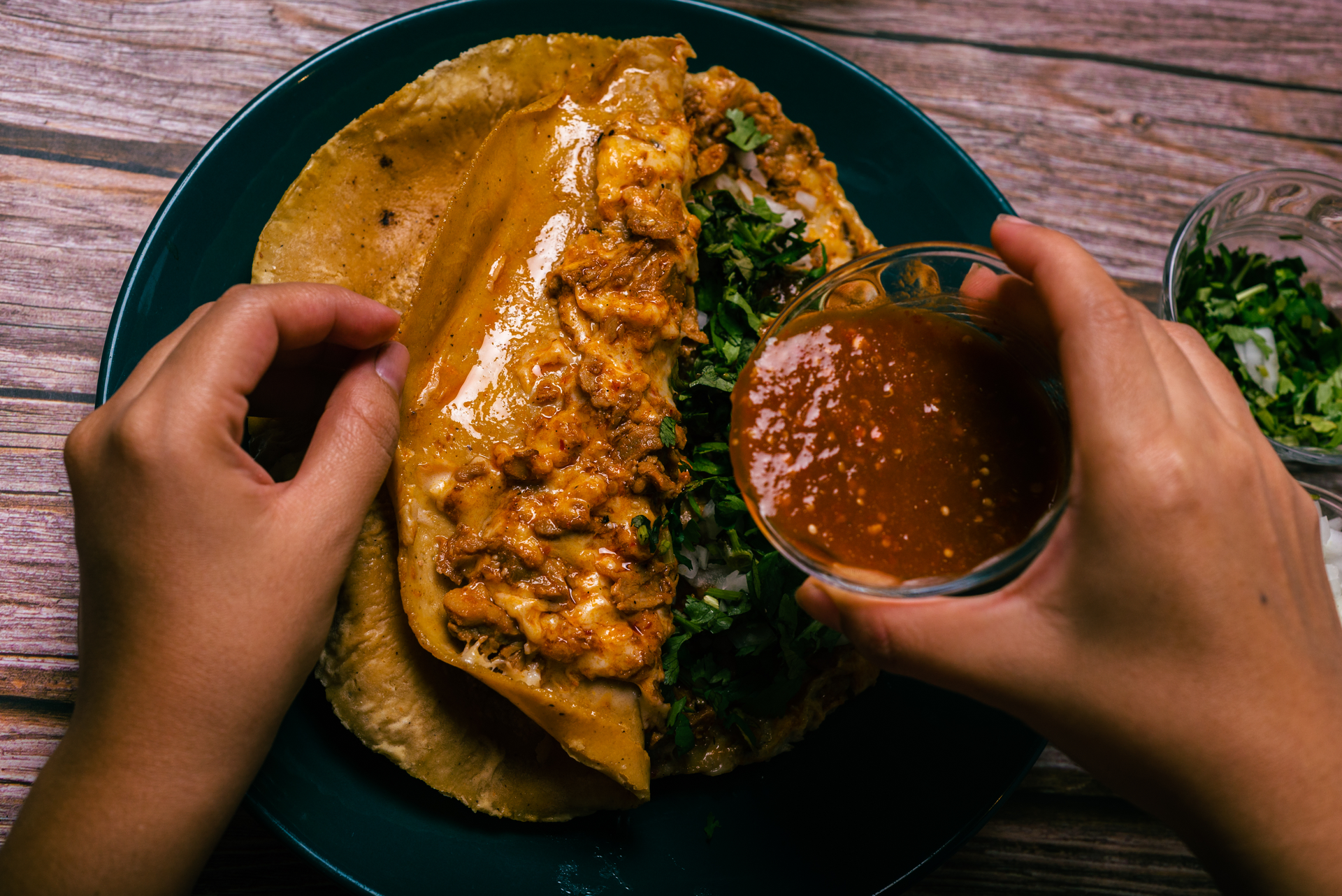 Overhead flat-lay of all ingredients for Sizzling Indonesian Rendang Taco with Spicy Coconut Sauce laid out on a kitchen surface.