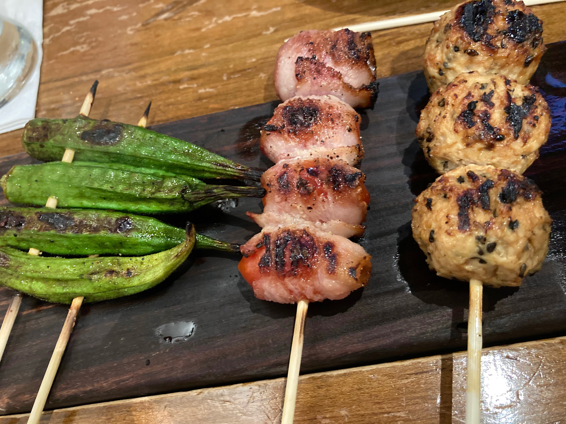 Overhead flat-lay of all ingredients for Sizzling Peruvian Anticucho Skewers with Chimichurri laid out on a kitchen surface.
