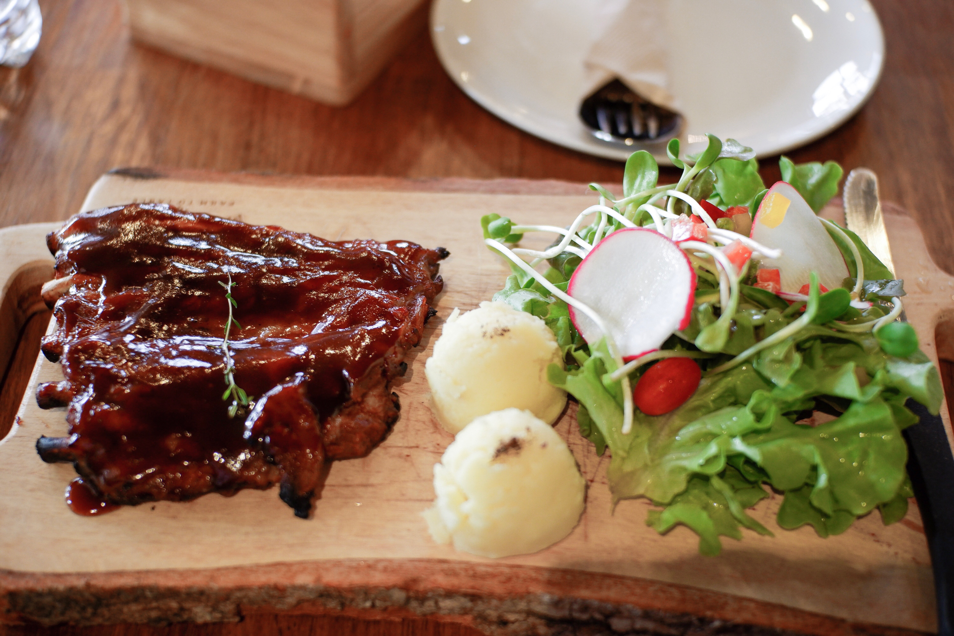 Overhead flat-lay of all ingredients for Smoky American BBQ Brisket with Bourbon Glaze laid out on a kitchen surface.