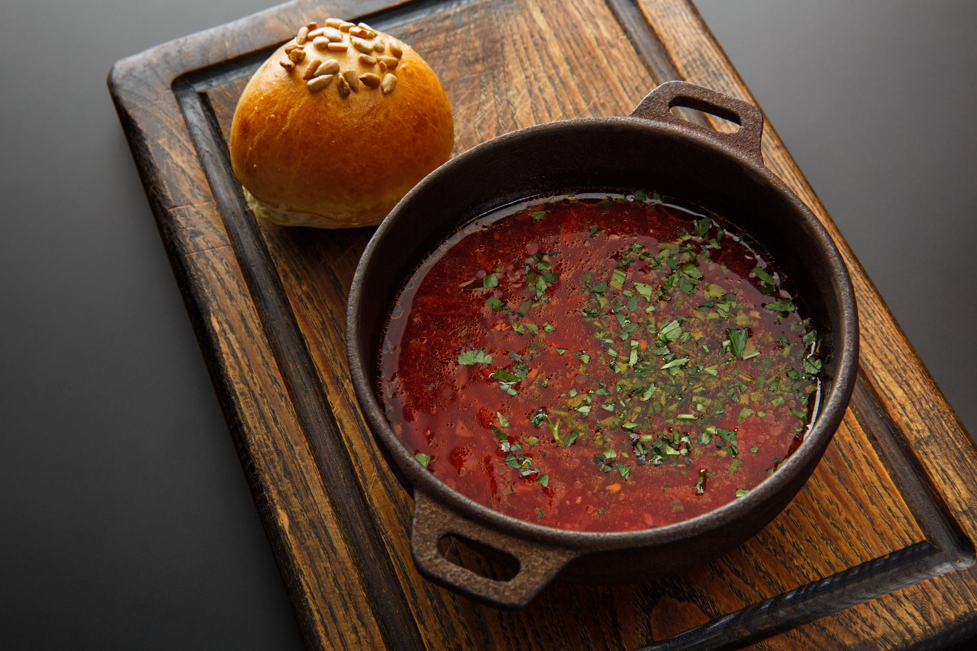 Overhead flat-lay of all ingredients for Smoky Andalusian Gazpacho with Roasted Red Peppers laid out on a kitchen surface.