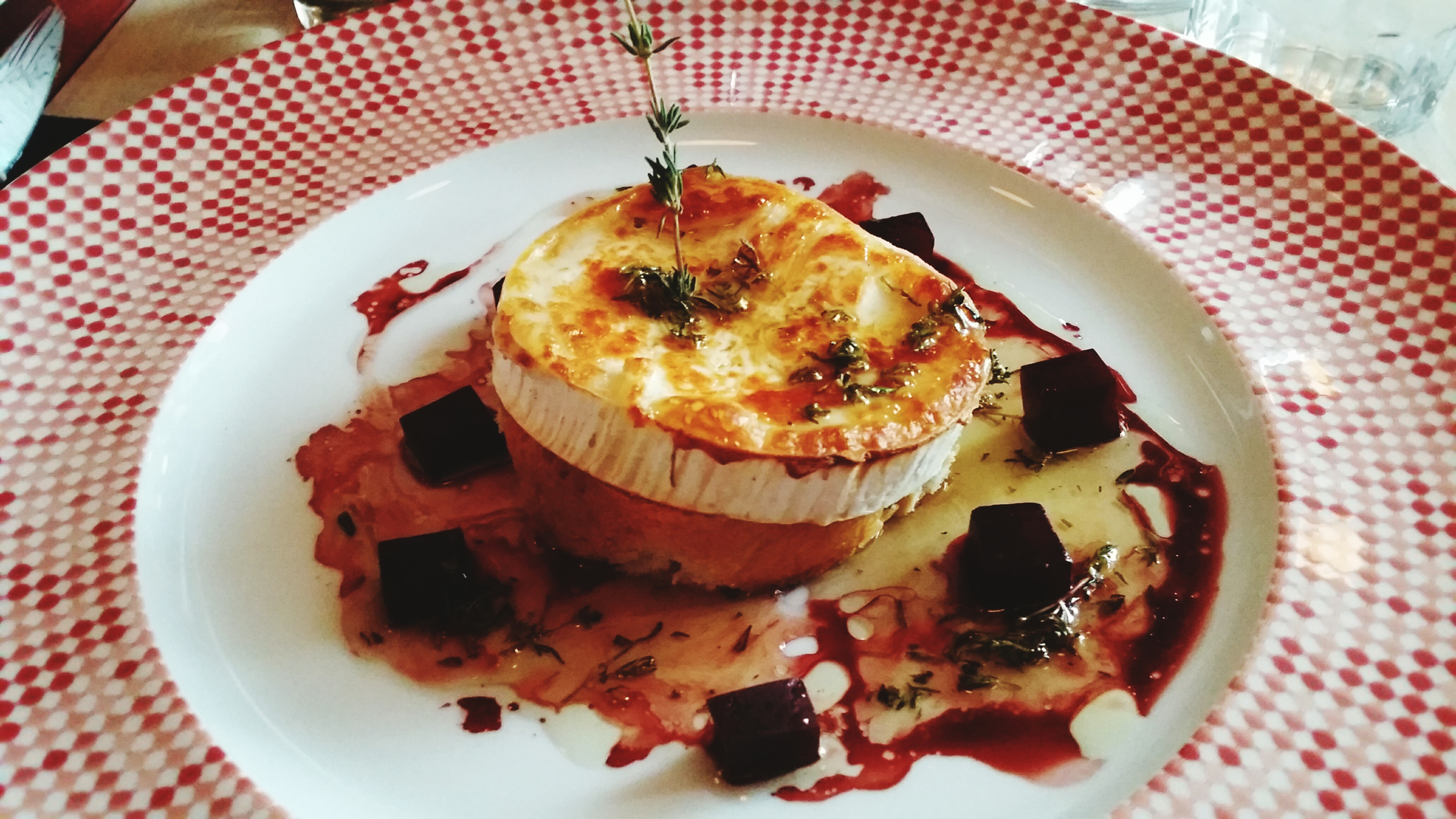 Smoky Argentinian Provoleta with Oregano — Appetizer served and photographed from above