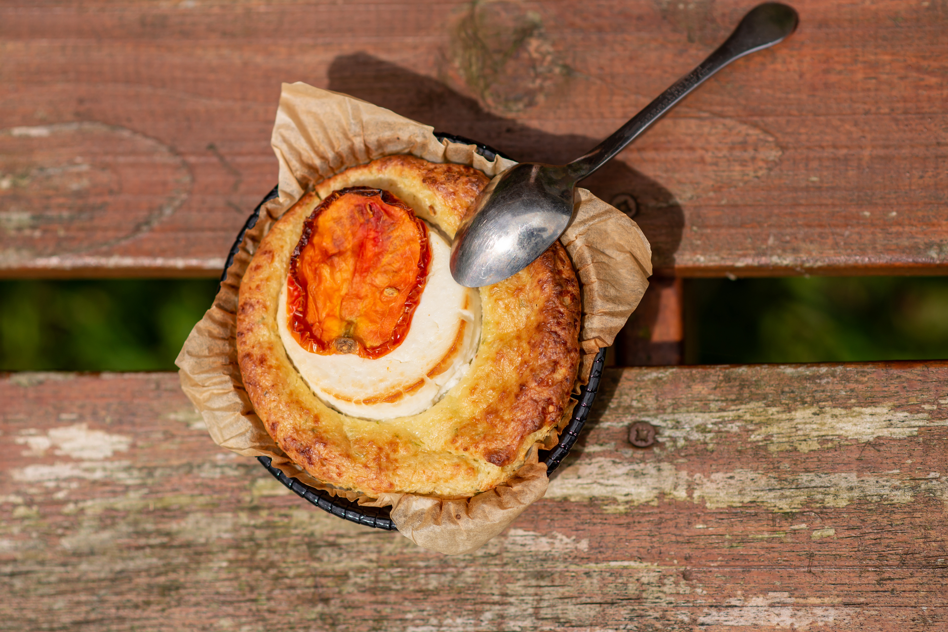 Overhead flat-lay of all ingredients for Smoky Basque Idiazabal Cheese Tart with Shallot Marmalade laid out on a kitchen surface.