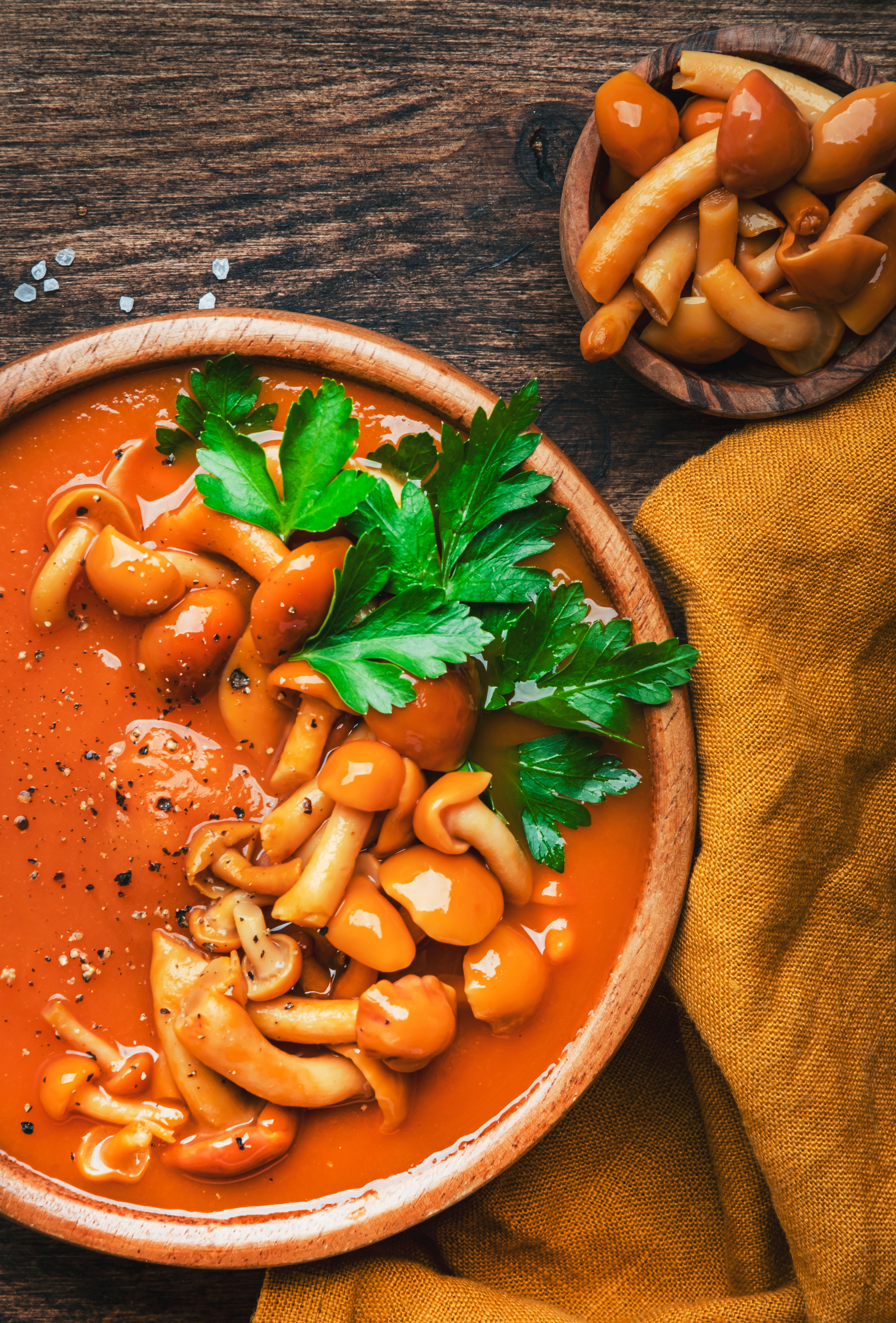 Overhead flat-lay of all ingredients for Smoky Bolivian Sopa de Mani with Peanut Garnish laid out on a kitchen surface.