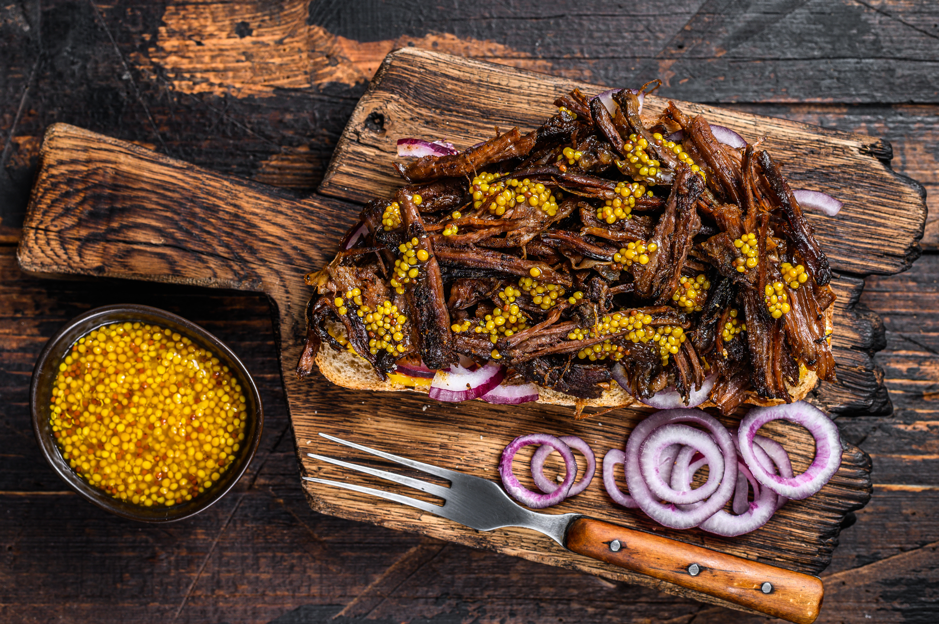 Overhead flat-lay of all ingredients for Smoky Brazilian Churrasco with Farofa laid out on a kitchen surface.