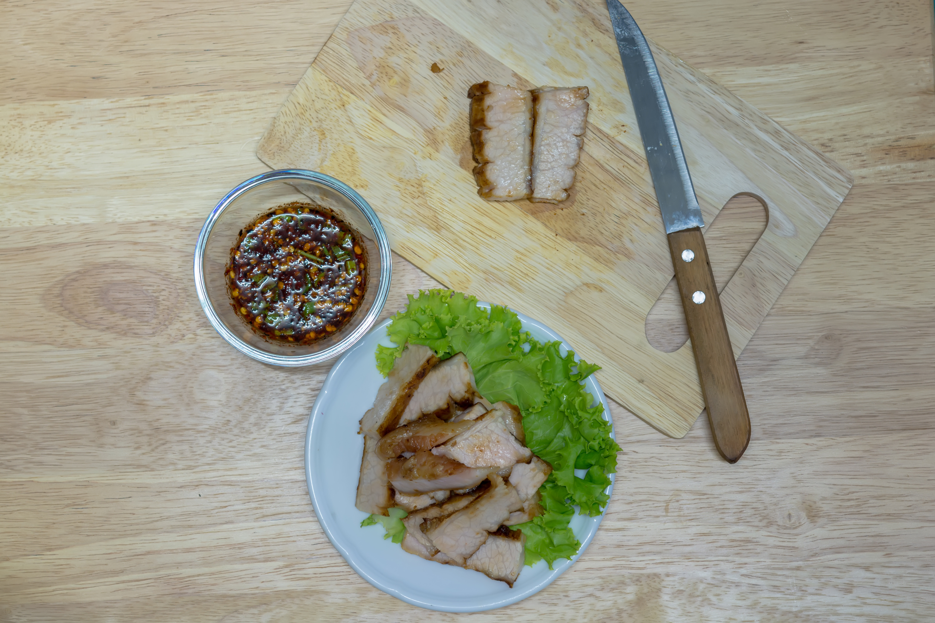 Overhead flat-lay of all ingredients for Smoky Korean Galbi with Sesame Marinade laid out on a kitchen surface.