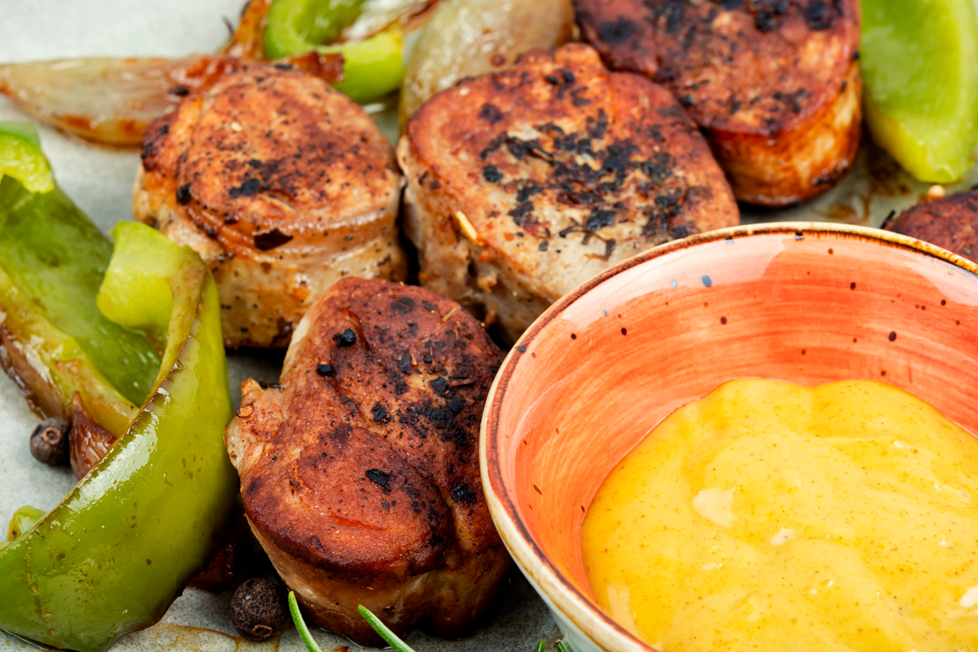 Overhead flat-lay of all ingredients for Smoky Peruvian Anticuchos with Aji Sauce laid out on a kitchen surface.