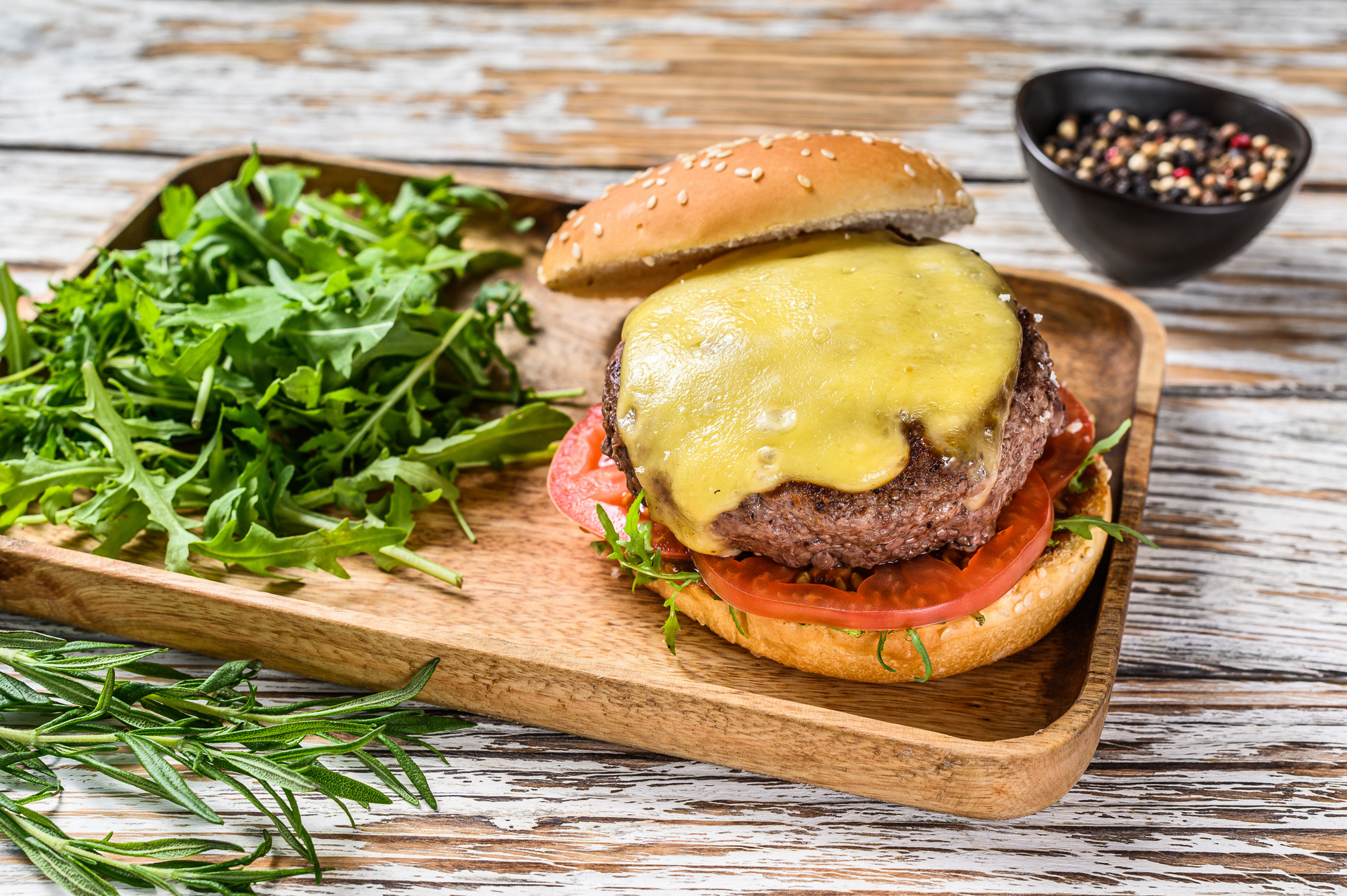 Smoky Swiss Raclette Burger with Alpine Herb Relish — Main Course served and photographed from above