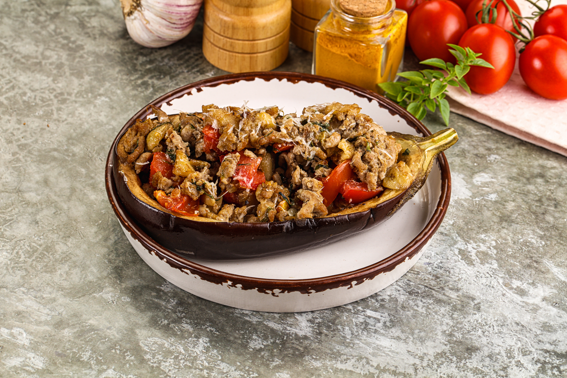 Overhead flat-lay of all ingredients for Smoky Turkish Karniyarik with Eggplant and Minced Lamb laid out on a kitchen surface.