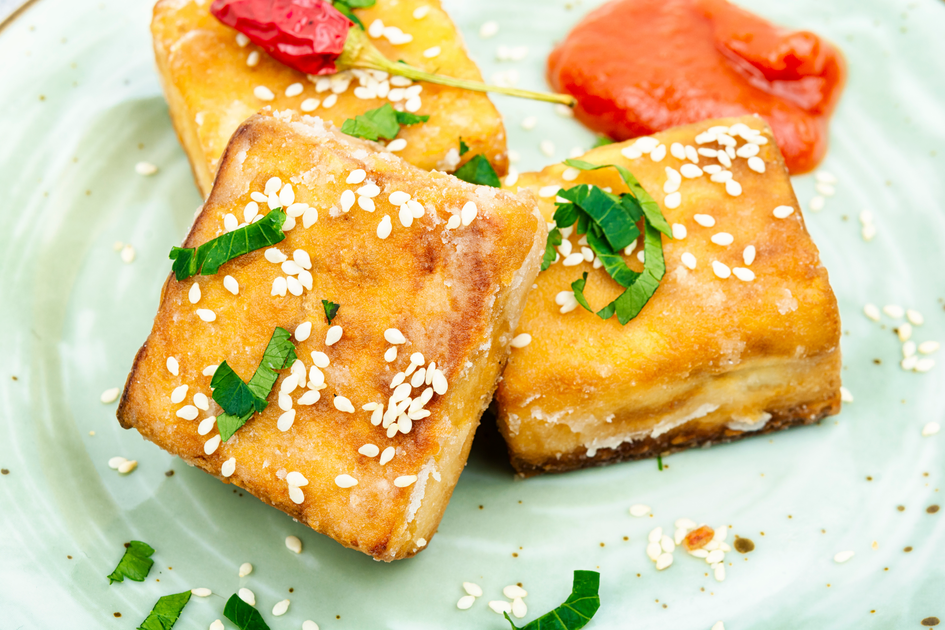 Overhead flat-lay of all ingredients for South African Bobotie Phyllo Bites with Apricot Glaze laid out on a kitchen surface.