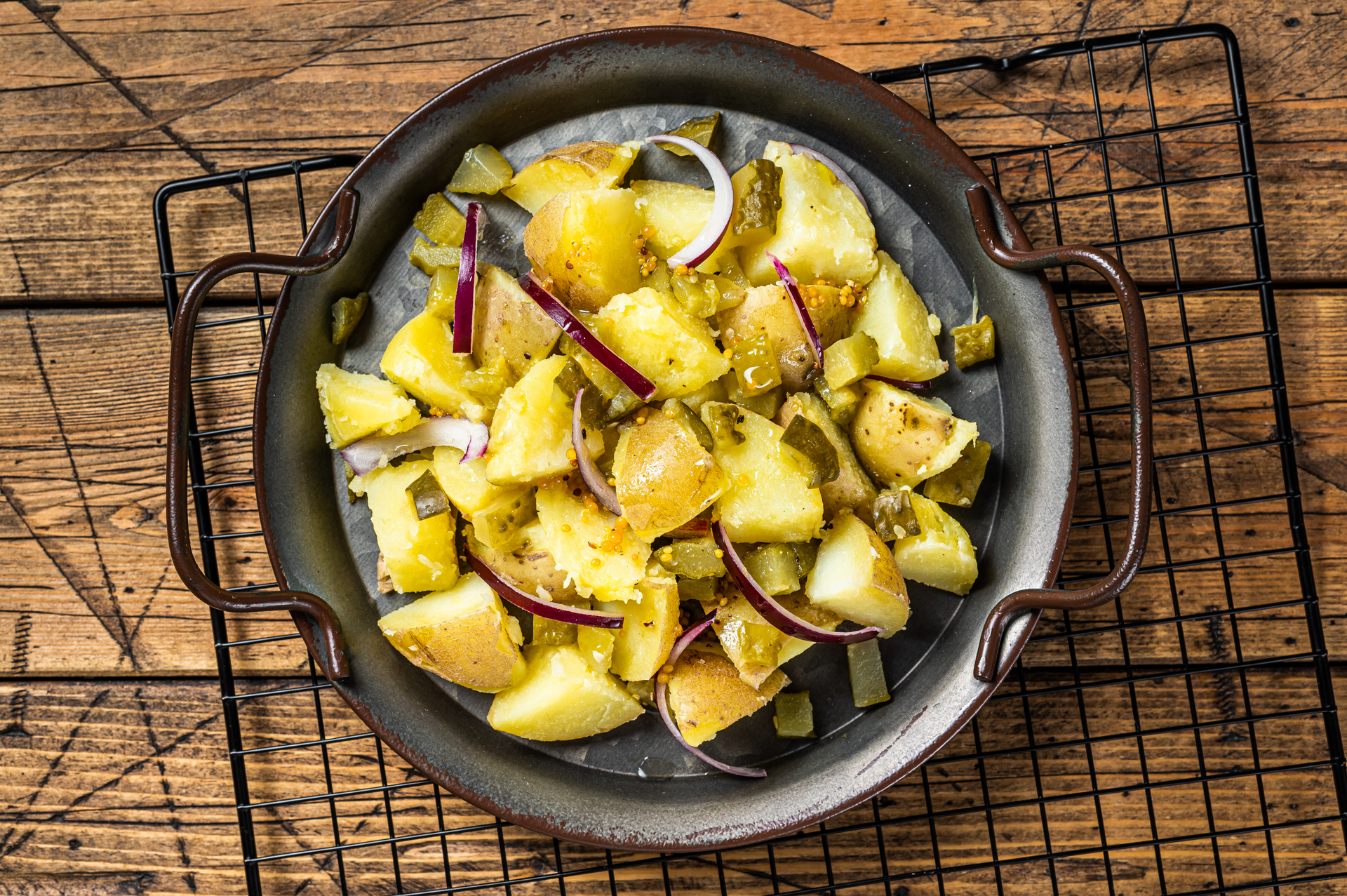 Overhead flat-lay of all ingredients for Spiced Ethiopian Atakilt Wat with Cabbage and Potatoes laid out on a kitchen surface.