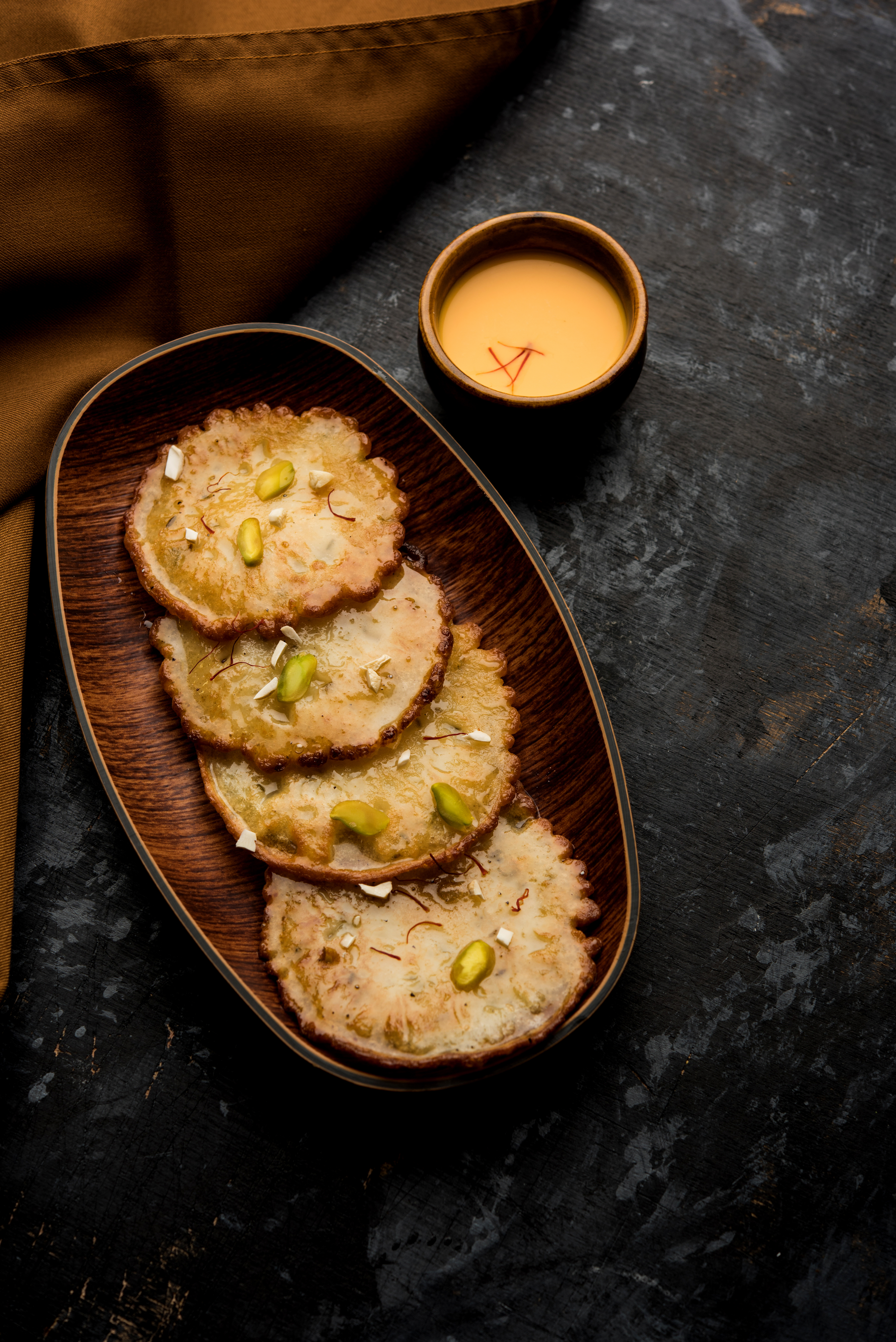 Overhead flat-lay of all ingredients for Spiced Indian Khasta Kachori with Moong Dal Filling laid out on a kitchen surface.