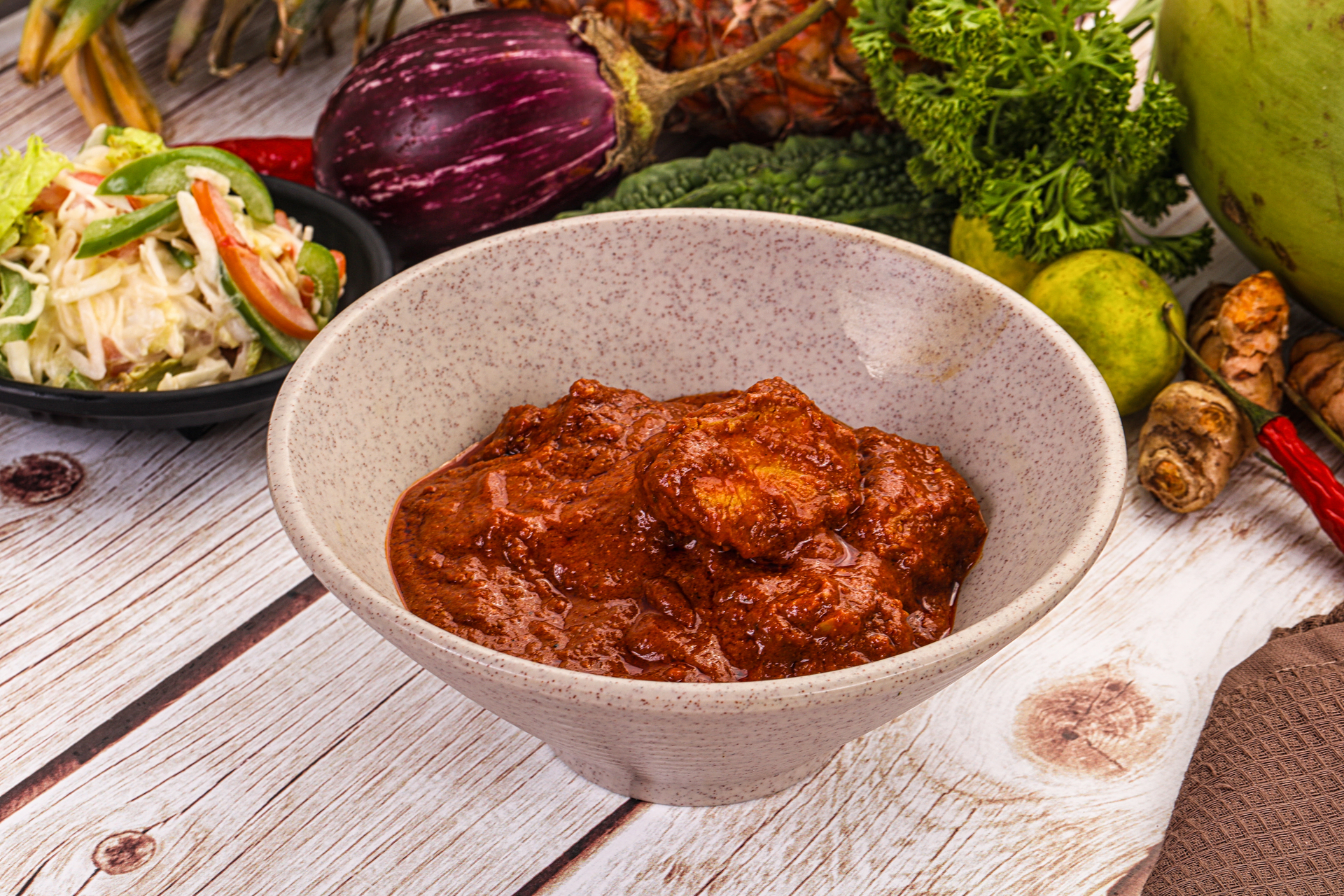 Overhead flat-lay of all ingredients for Spicy Balinese Sambal Ayam with Sweet Potato Mash laid out on a kitchen surface.