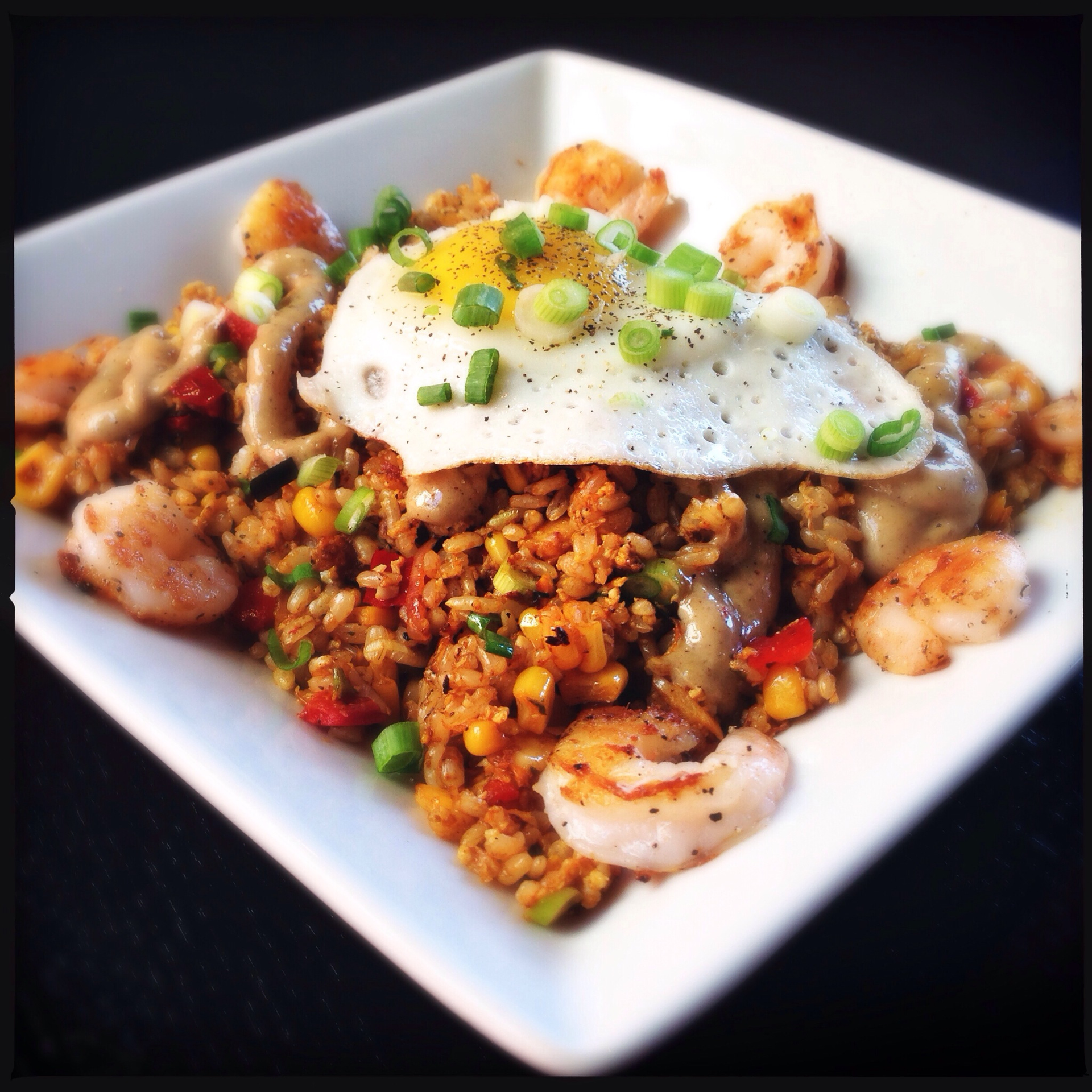 Overhead flat-lay of all ingredients for Spicy Bolivian Quinoa Chicharrón with Aji Sauce laid out on a kitchen surface.