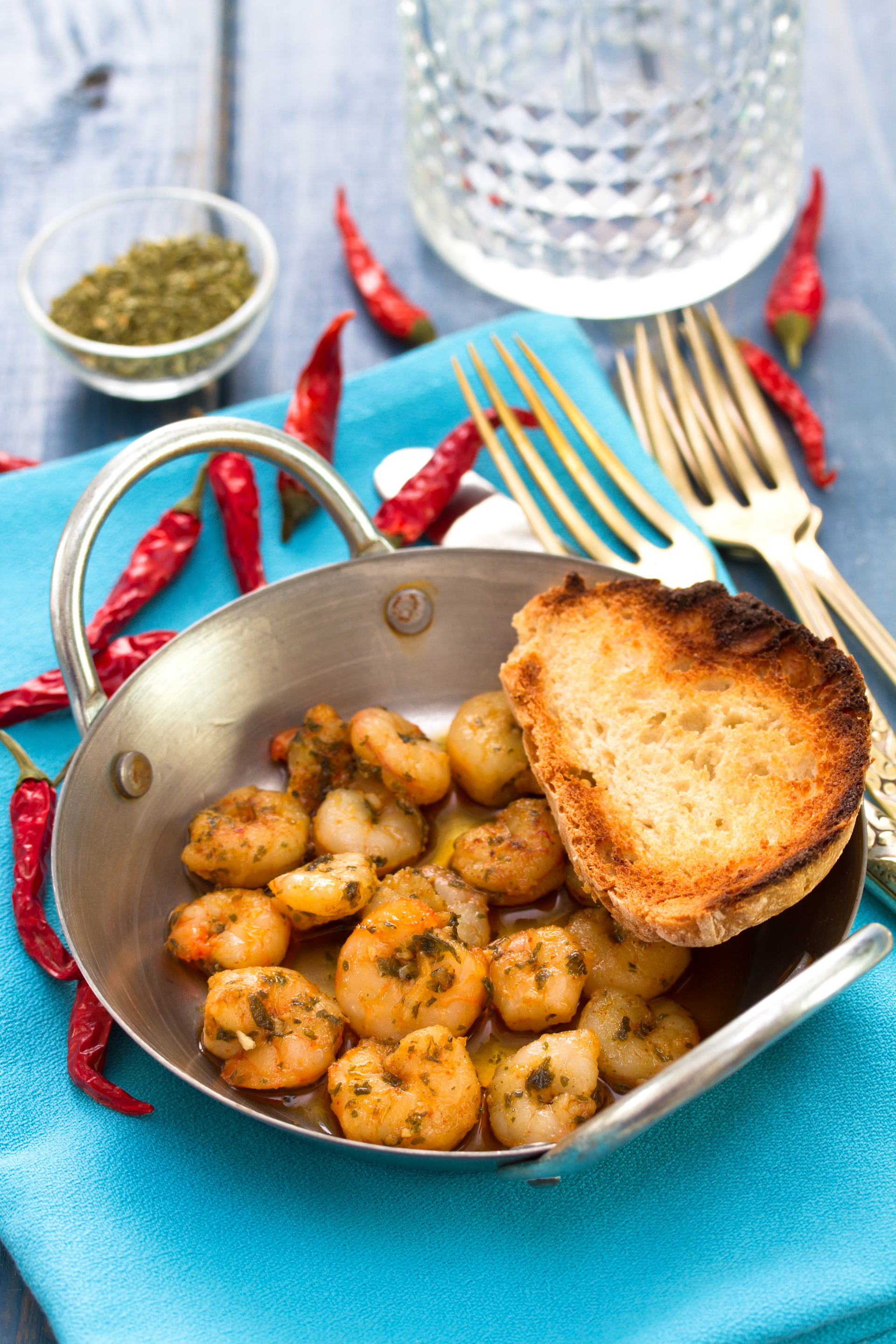 Overhead flat-lay of all ingredients for Spicy Cajun Crawfish Étouffée with Andouille Sausage laid out on a kitchen surface.