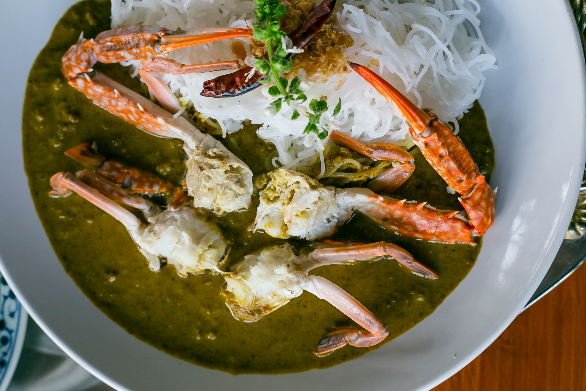 Spicy Caribbean Coconut Curry Crab with Lime Zest — Main Course served and photographed from above