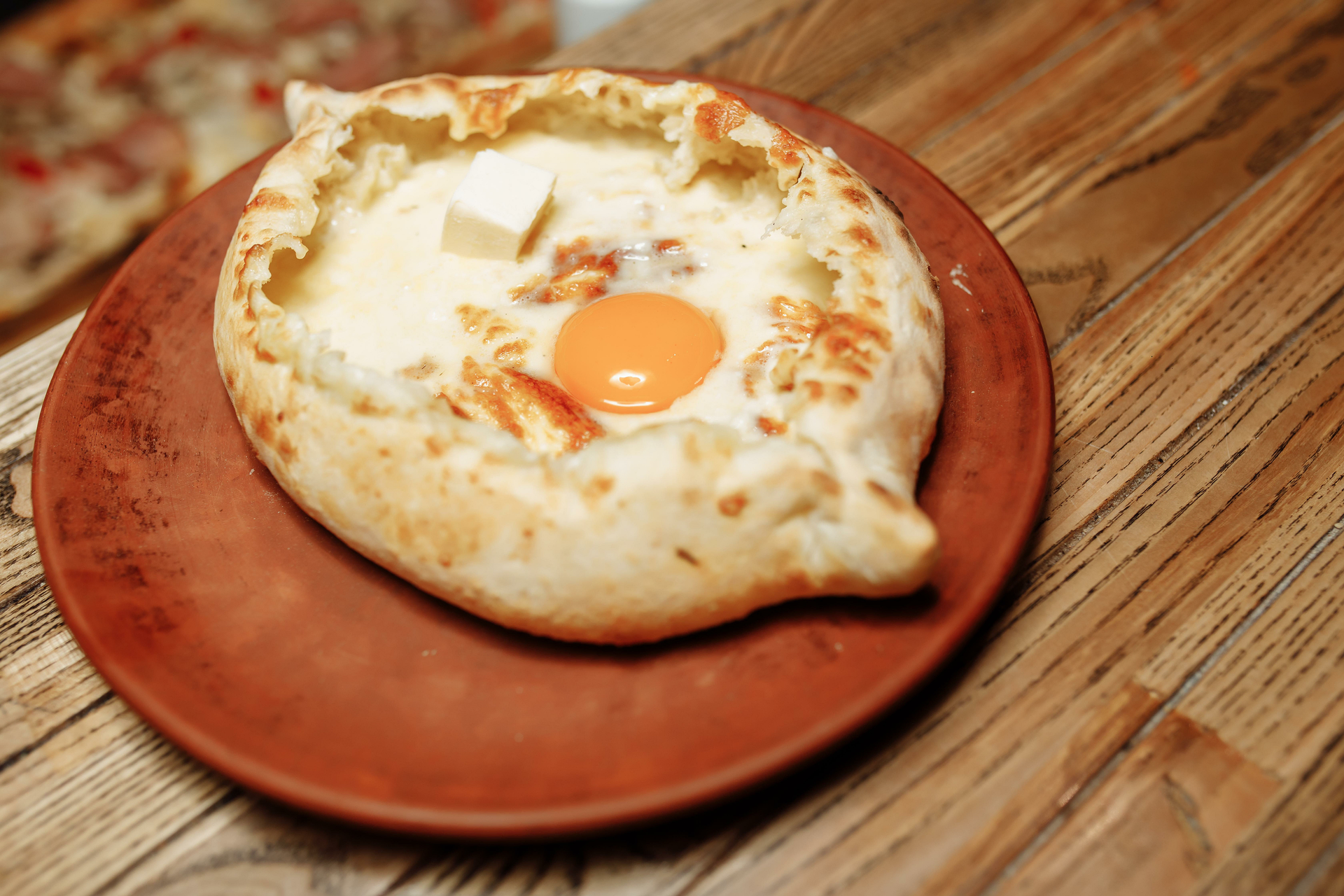 Spicy Georgian Adjarian Khachapuri with Runny Egg — Brunch served and photographed from above