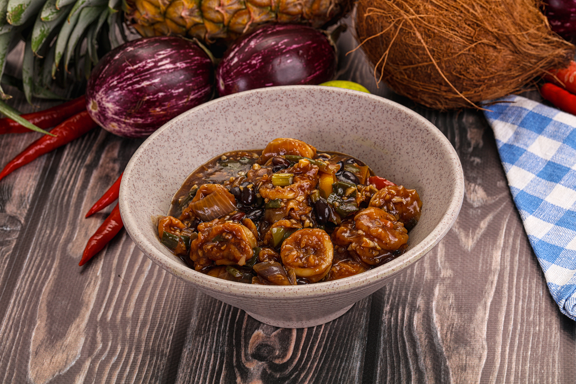 Overhead flat-lay of all ingredients for Spicy Goan Vindaloo with Tamarind and Masala laid out on a kitchen surface.