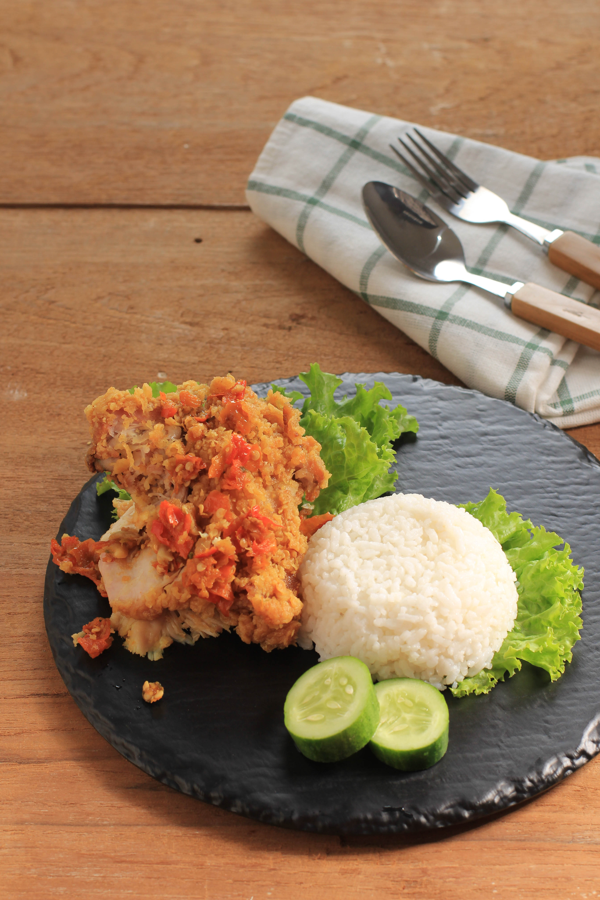 Spicy Indonesian Ayam Geprek with Sambal — Main Course served and photographed from above