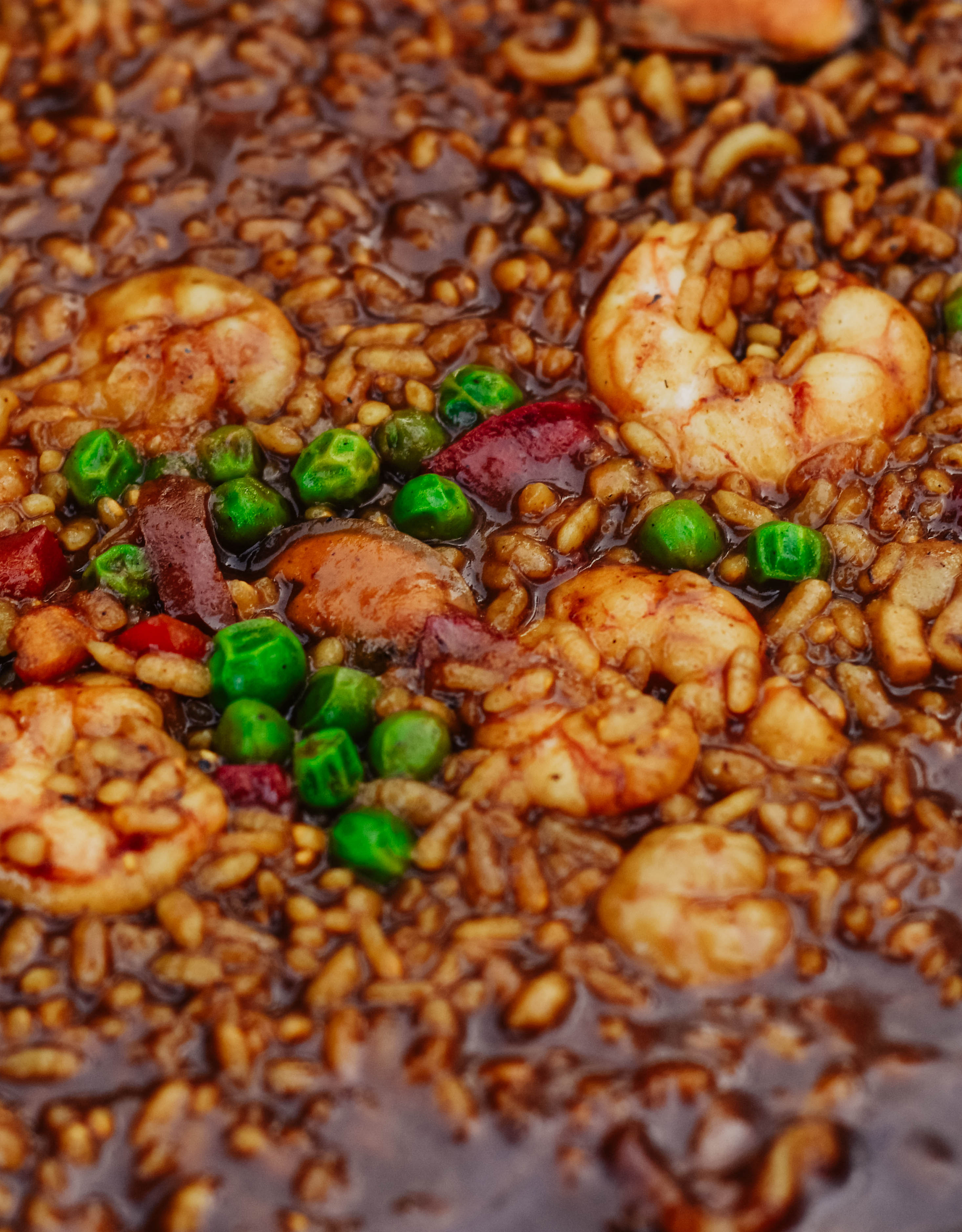 Overhead flat-lay of all ingredients for Spicy Jamaican Scotch Bonnet Pilaf with Shrimp laid out on a kitchen surface.