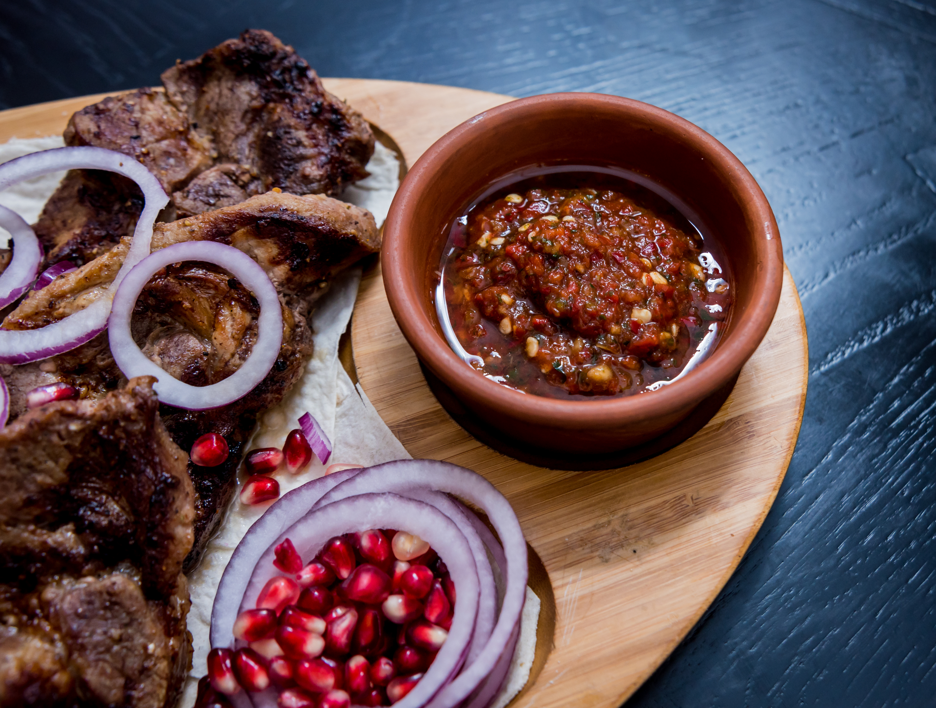 Overhead flat-lay of all ingredients for Spicy Kenyan Nyama Choma with Kachumbari Salsa laid out on a kitchen surface.