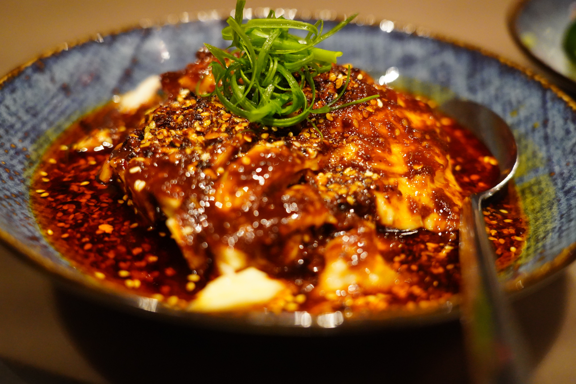 Overhead flat-lay of all ingredients for Spicy Korean Cheonggukjang with Fermented Soybean Paste laid out on a kitchen surface.