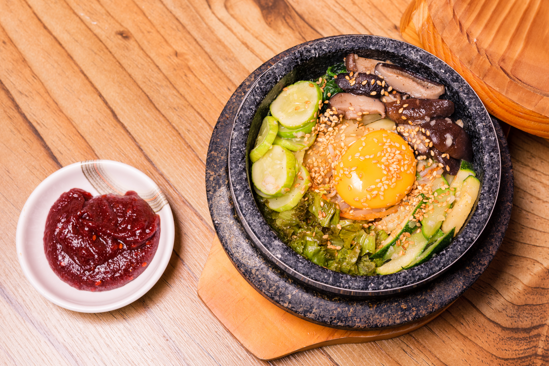 Overhead flat-lay of all ingredients for Spicy Korean Tuna Bibimbap with Sesame Dressing laid out on a kitchen surface.