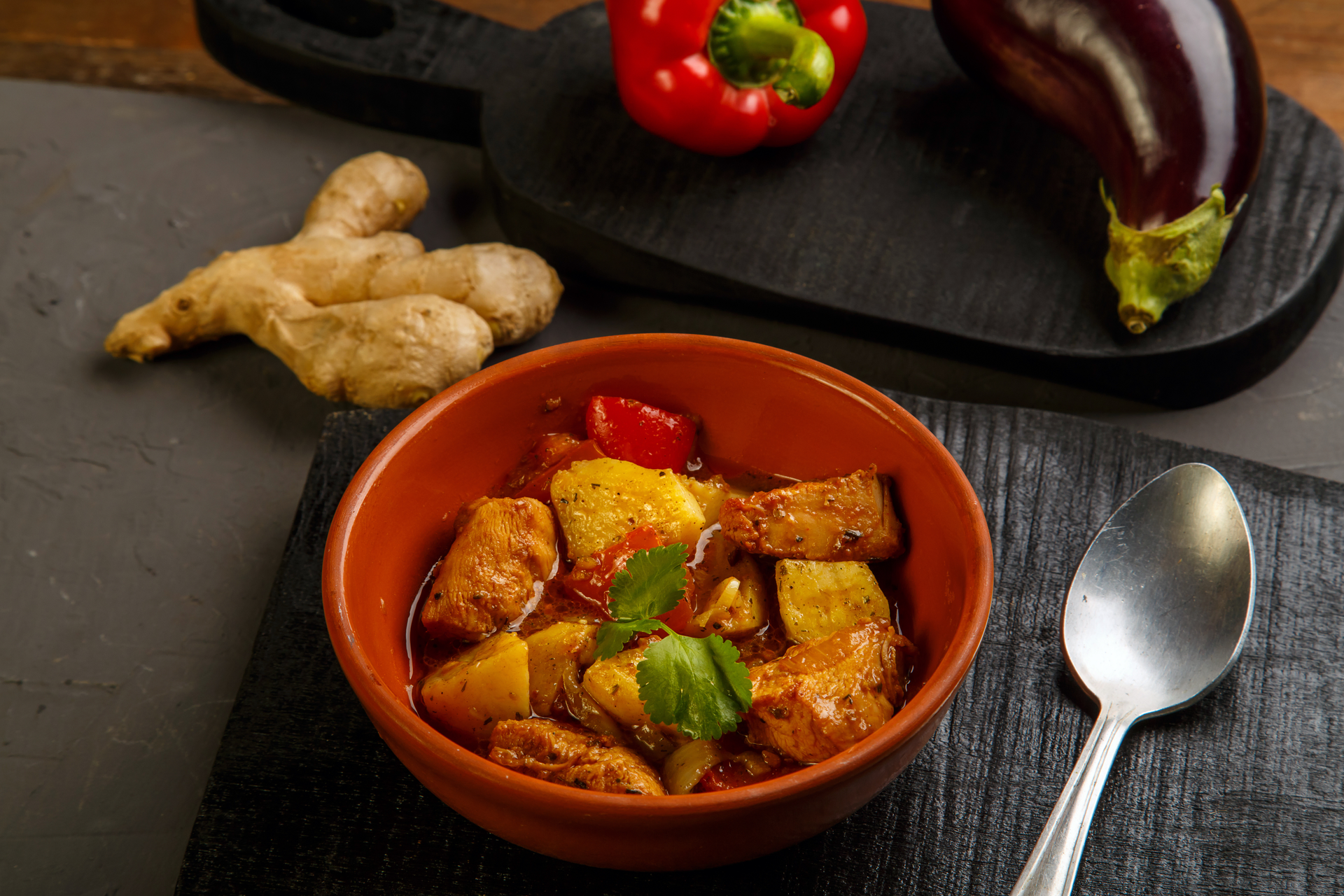 Overhead flat-lay of all ingredients for Spicy Mexican Adobo Chicken with Pumpkin Seed Sauce laid out on a kitchen surface.