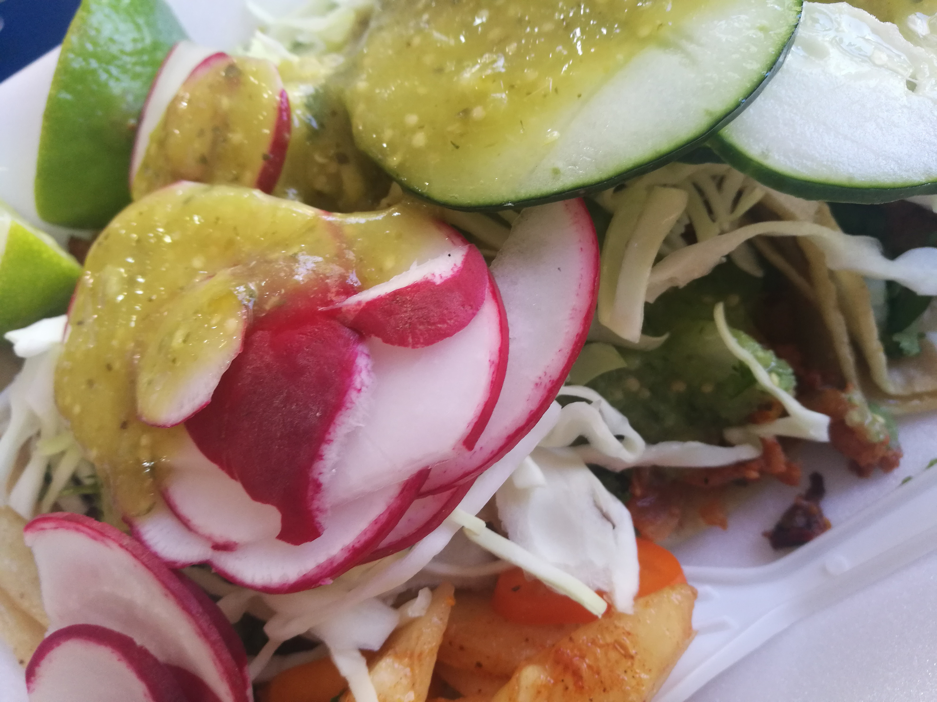 Overhead flat-lay of all ingredients for Spicy Mexican Aguachile with Shrimp and Cucumber laid out on a kitchen surface.