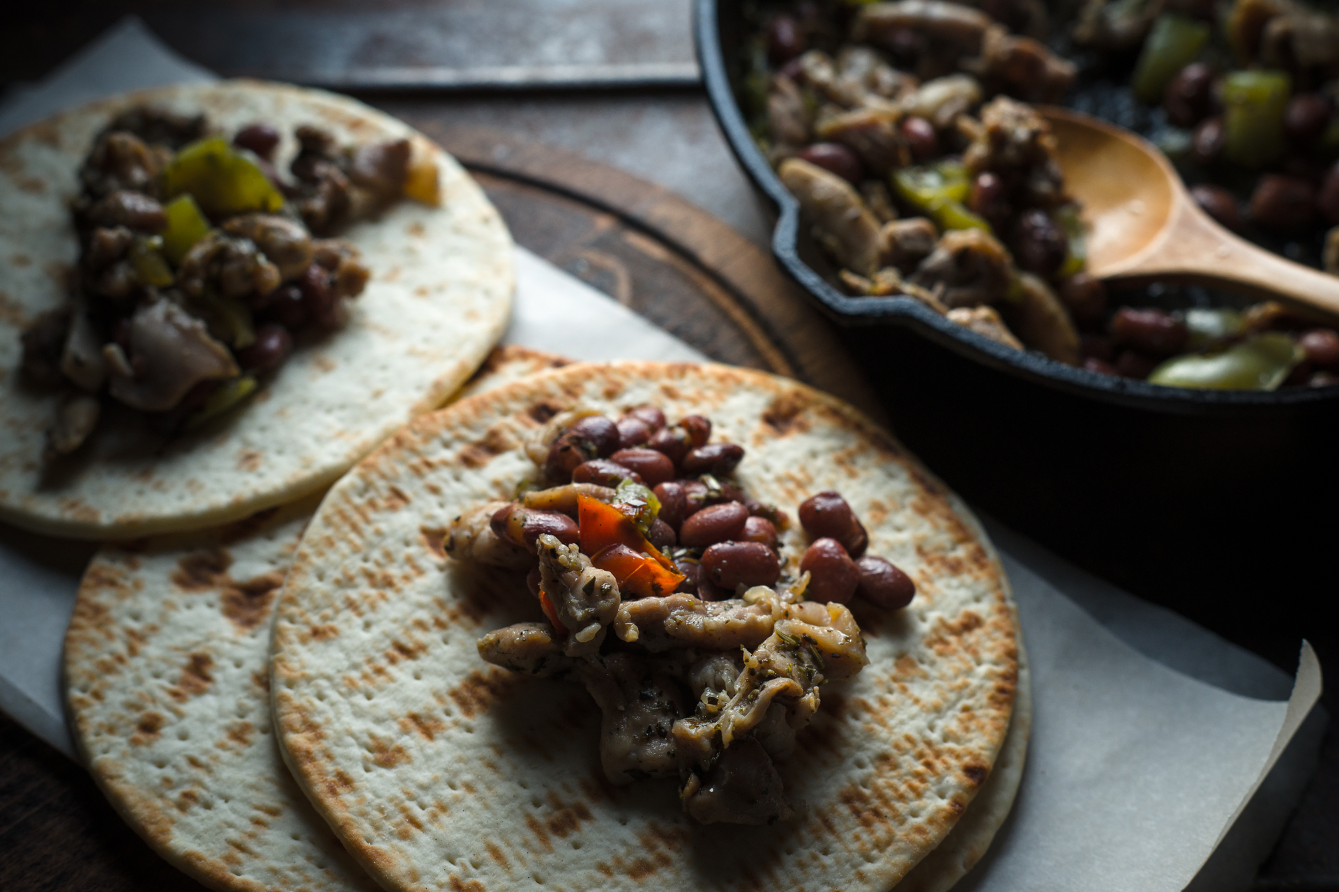 Spicy Mexican Huaraches with Black Bean Purée — Main Course served and photographed from above
