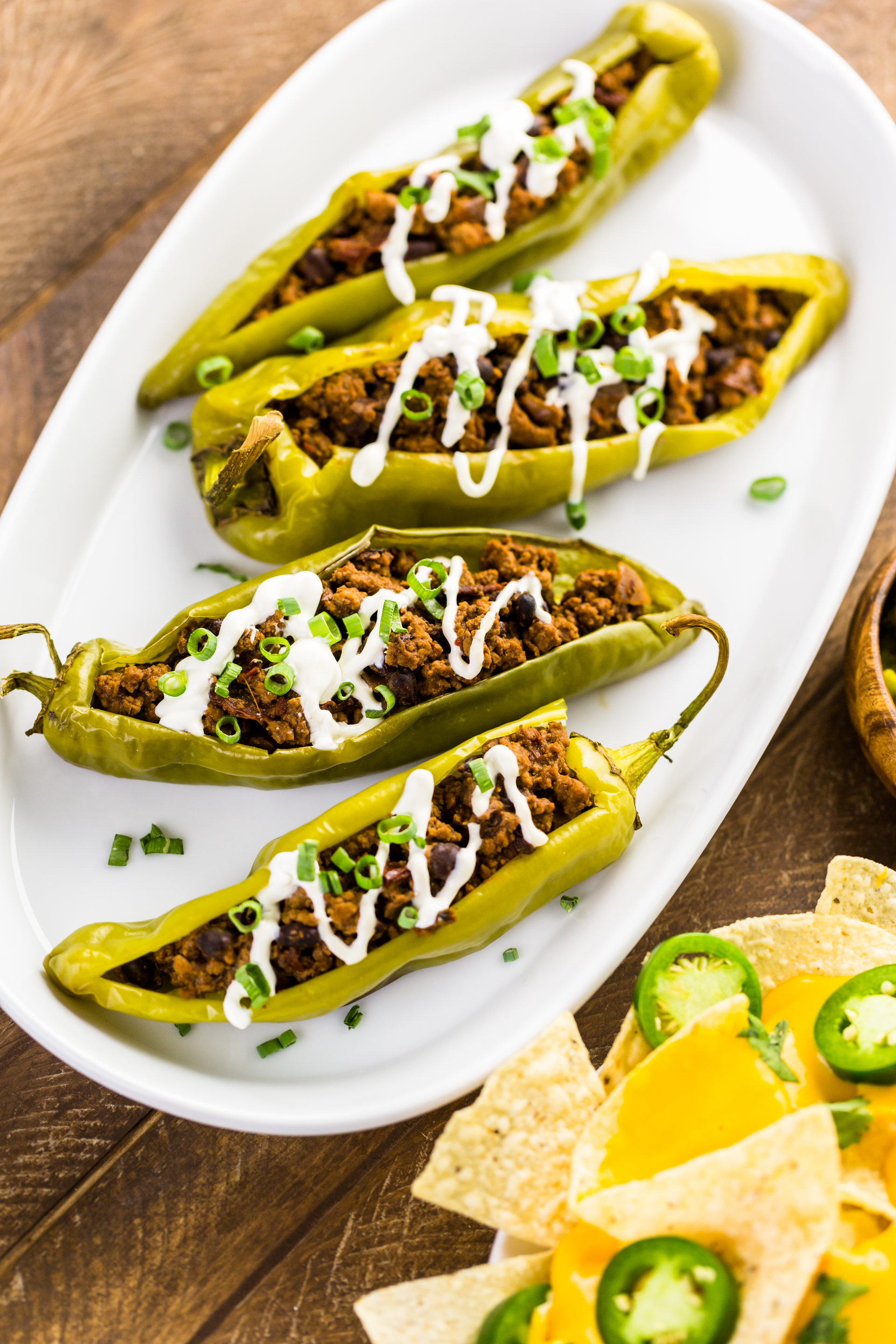 Overhead flat-lay of all ingredients for Spicy Mexican Jalapeño Poppers with Cotija Cheese laid out on a kitchen surface.