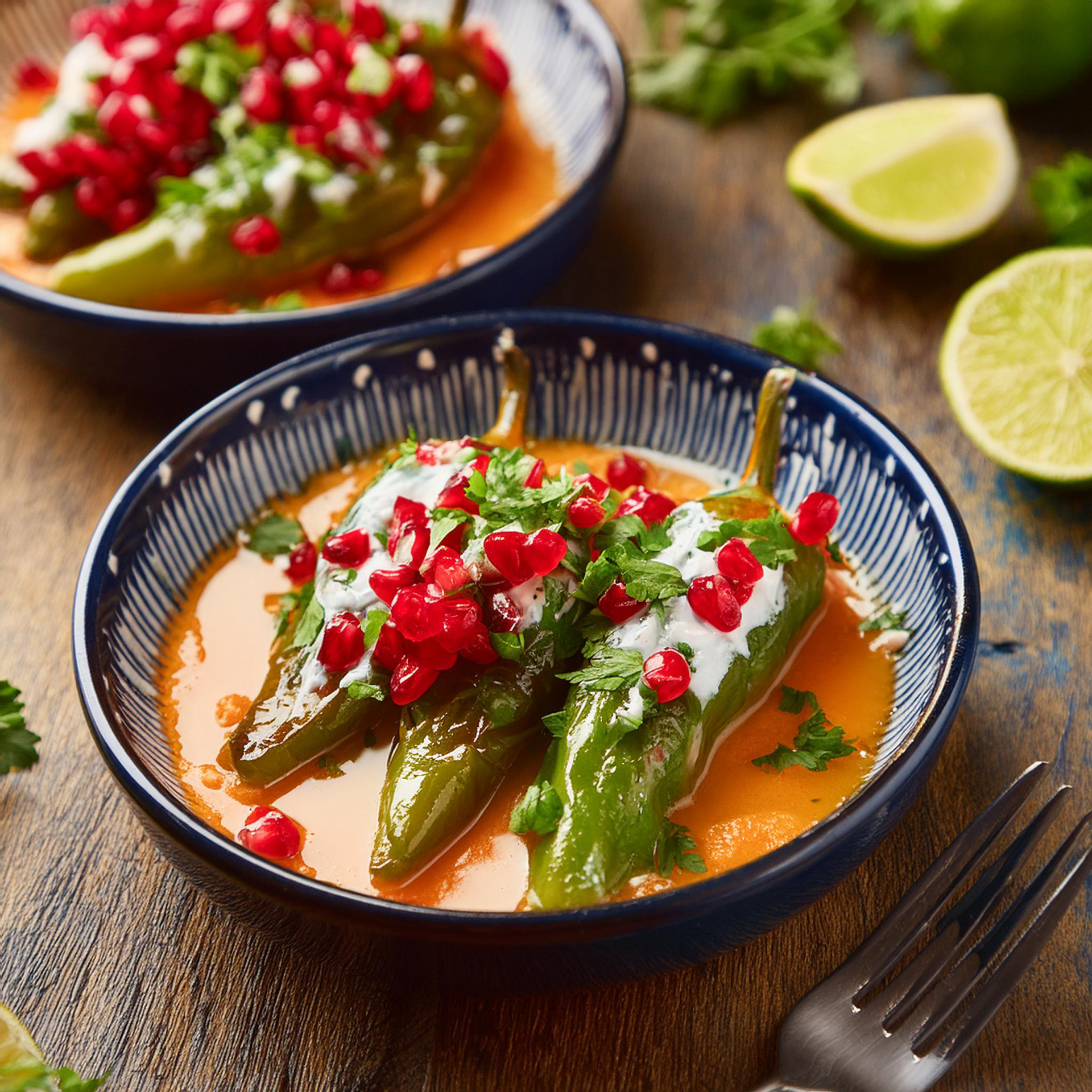 Overhead flat-lay of all ingredients for Spicy Mexican Rajas con Crema with Poblano Peppers laid out on a kitchen surface.