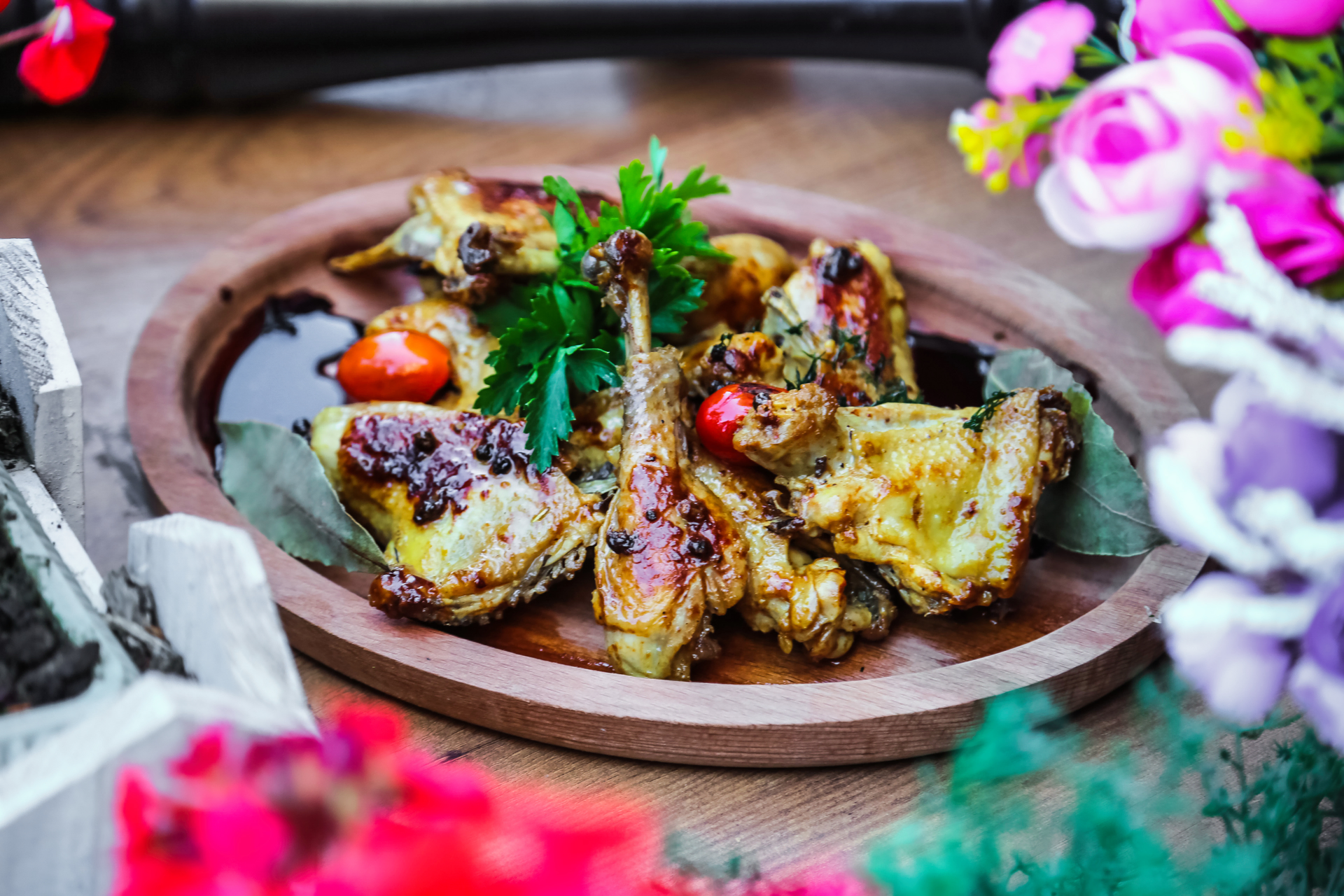 Overhead flat-lay of all ingredients for Spicy Moroccan Grilled Lamb Chops with Chermoula laid out on a kitchen surface.