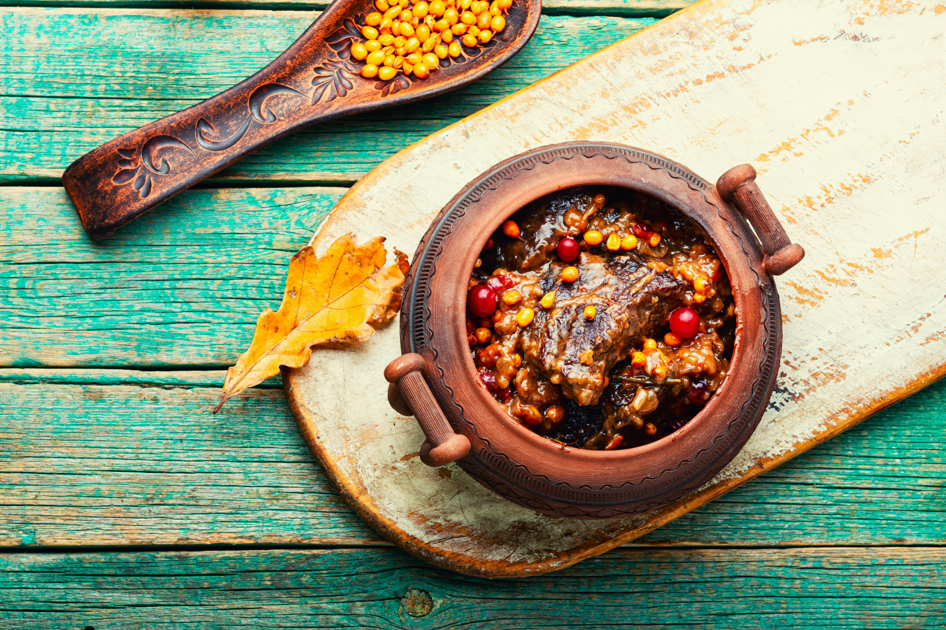 Overhead flat-lay of all ingredients for Spicy Moroccan Lamb Tagine laid out on a kitchen surface.