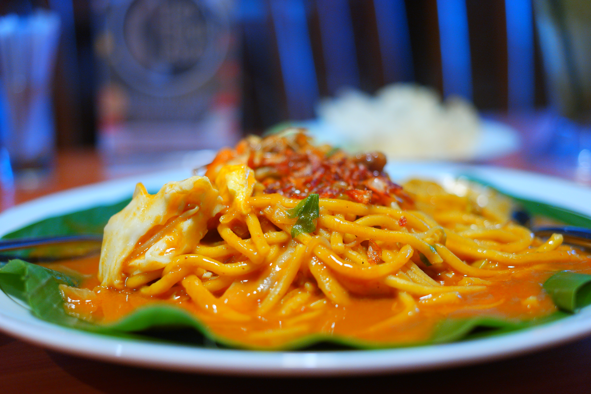 Overhead flat-lay of all ingredients for Spicy Peruvian Aji Amarillo Pasta with Chicken and Lime laid out on a kitchen surface.