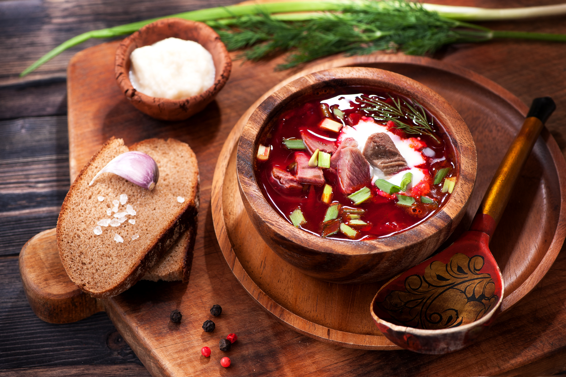 Overhead flat-lay of all ingredients for Spicy Scandinavian Reindeer Stew with Lingonberry Relish laid out on a kitchen surface.