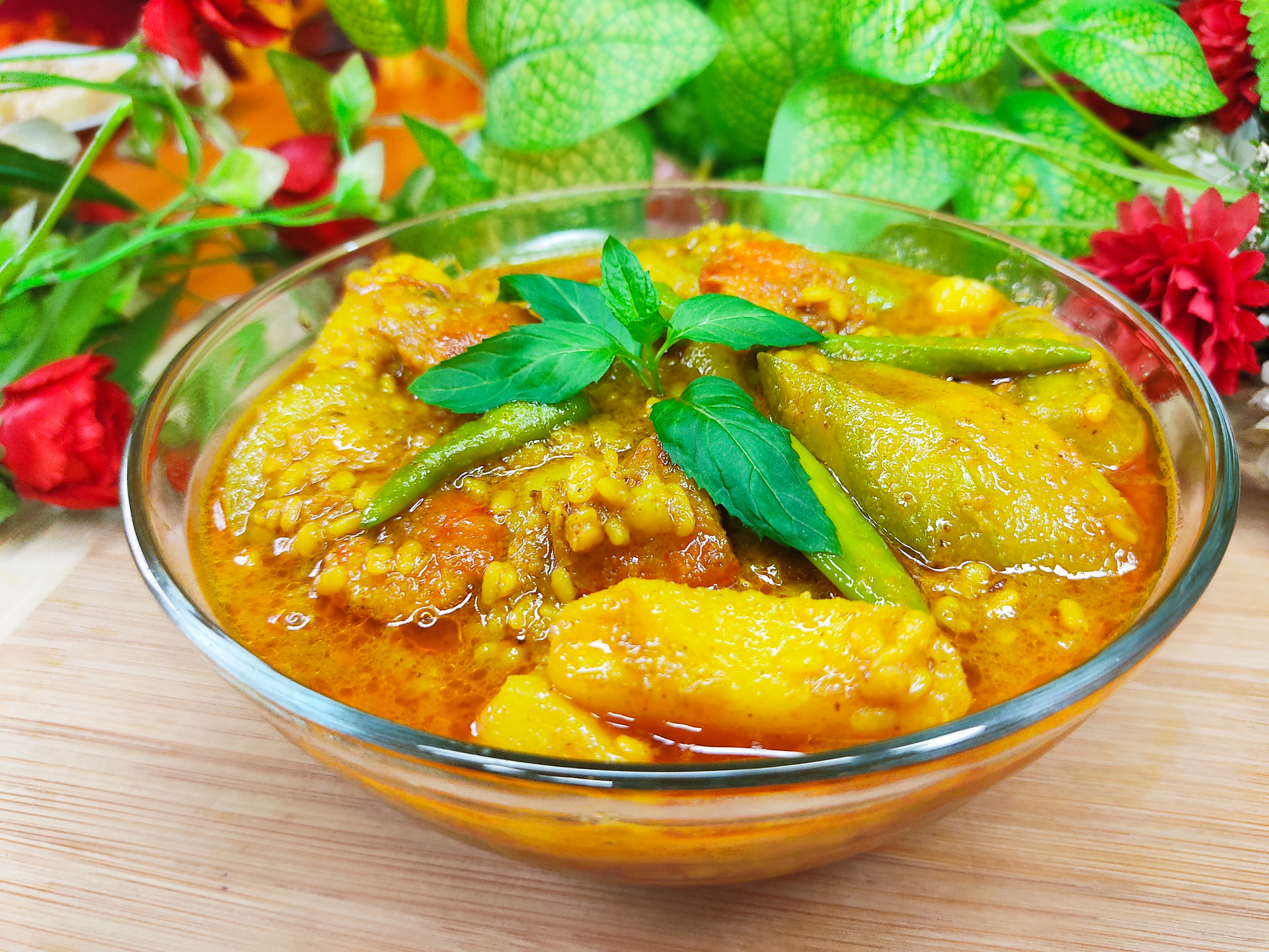 Overhead flat-lay of all ingredients for Spicy South Indian Chettinad Chicken Curry laid out on a kitchen surface.