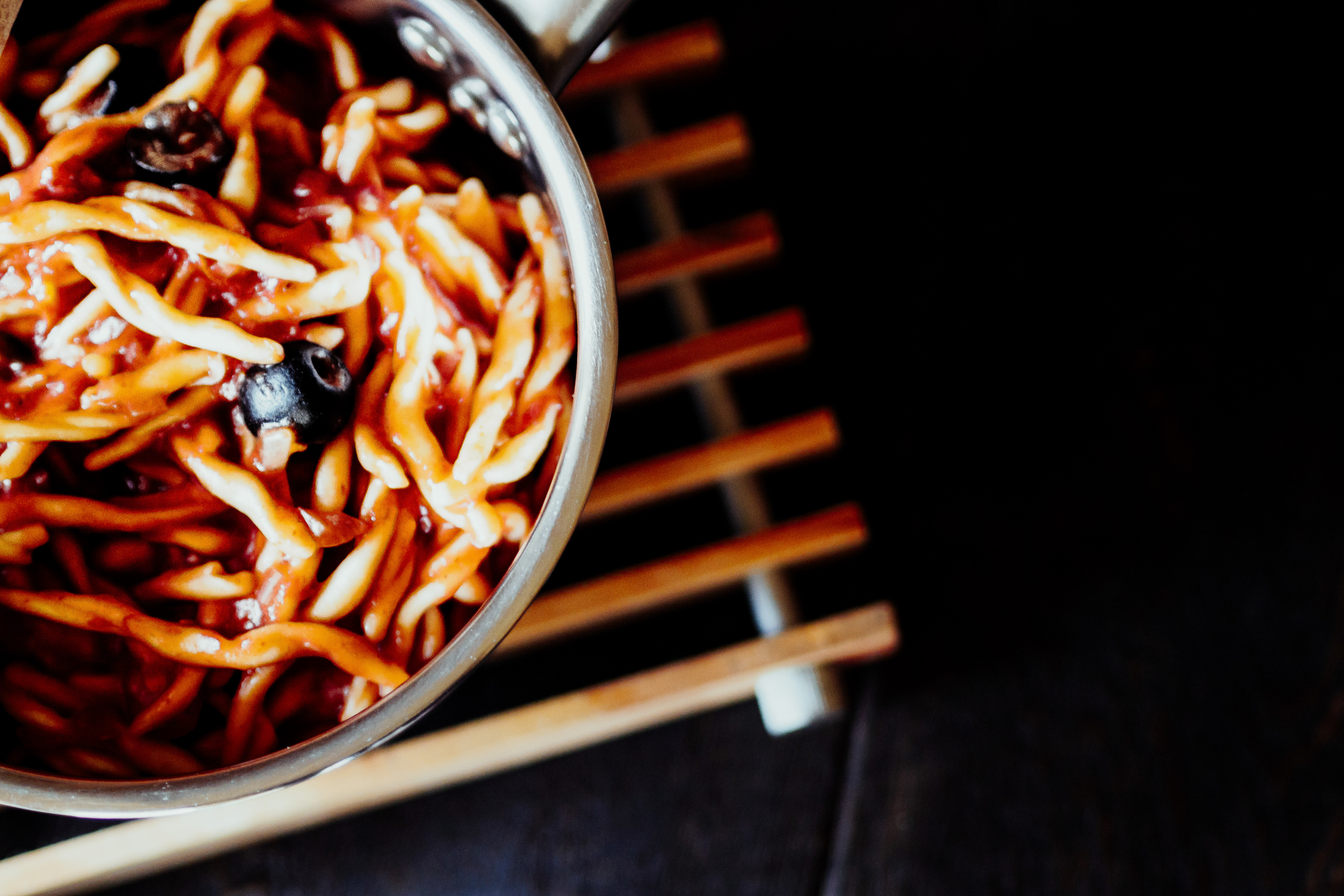 Overhead flat-lay of all ingredients for Spicy Szechuan Dan Dan Noodles with Chili Oil laid out on a kitchen surface.