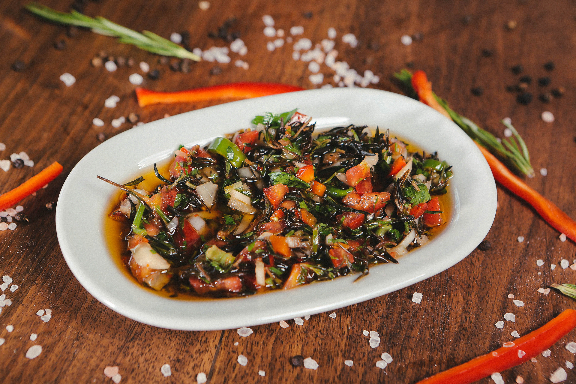 Overhead flat-lay of all ingredients for Spicy Thai Basil Eggplant Stir-Fry with Sesame laid out on a kitchen surface.