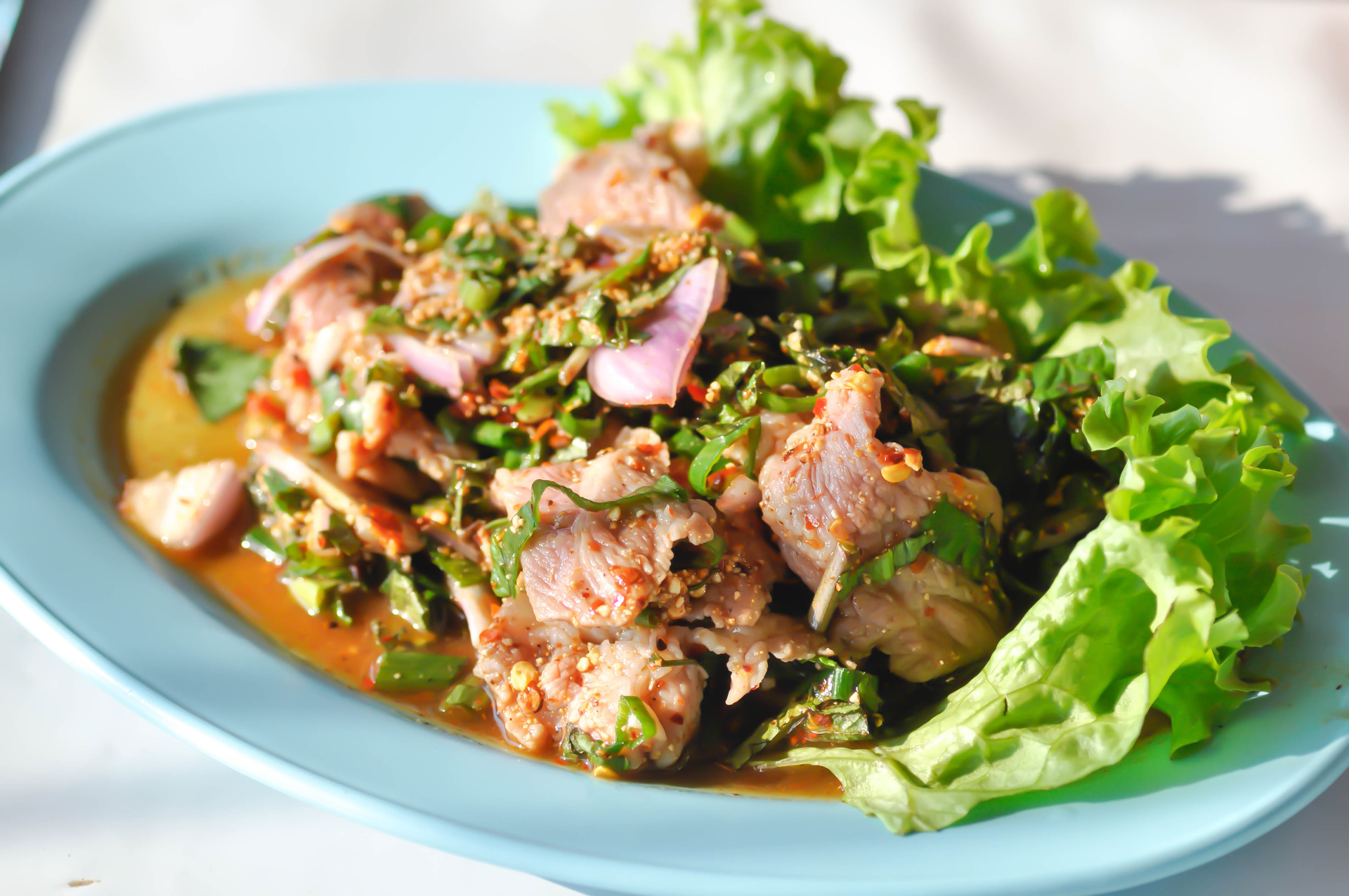 Spicy Thai Tamarind Duck with Fresh Basil — Main Course served and photographed from above