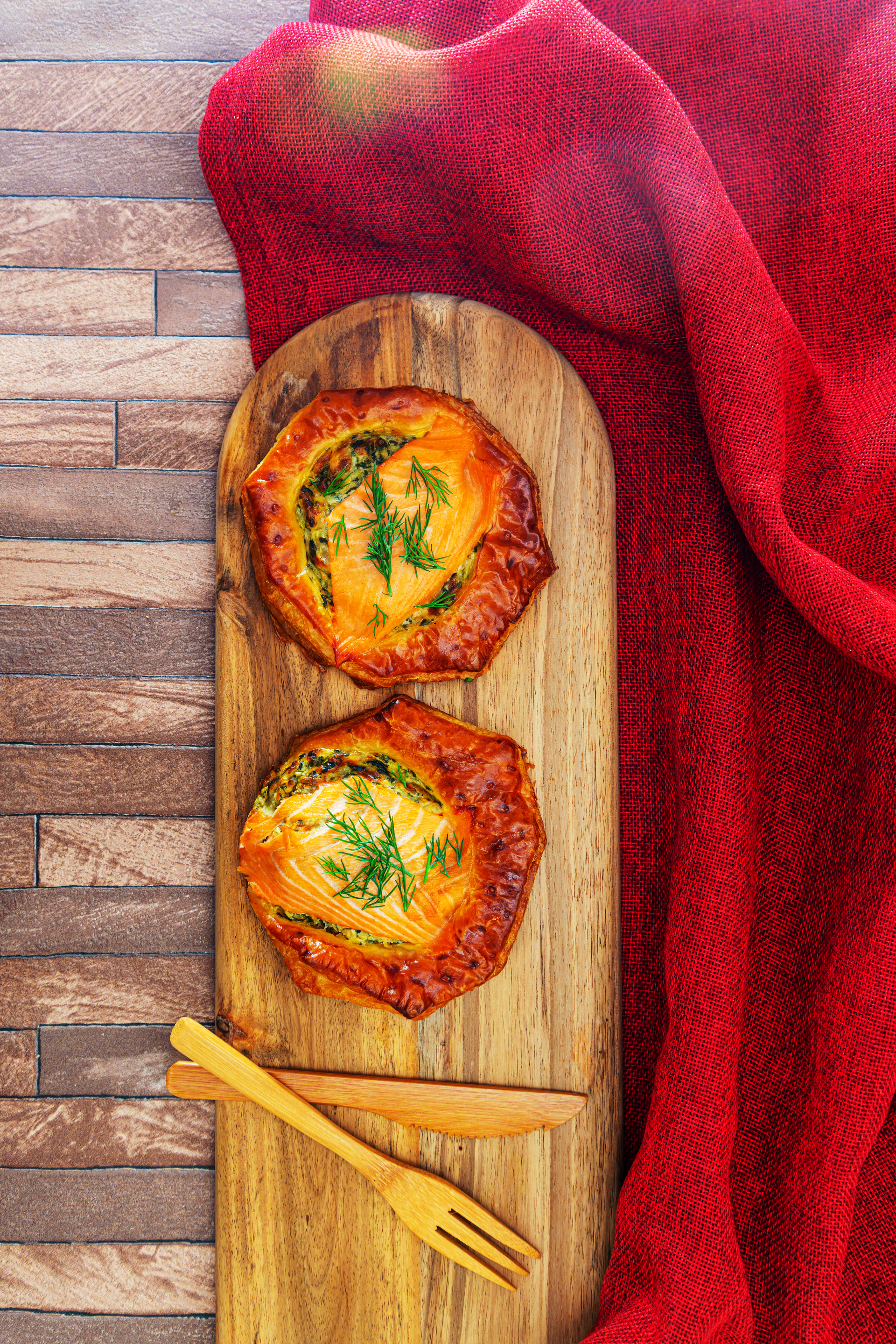 Overhead flat-lay of all ingredients for Spicy Tunisian Brik Pastries with Egg and Harissa laid out on a kitchen surface.