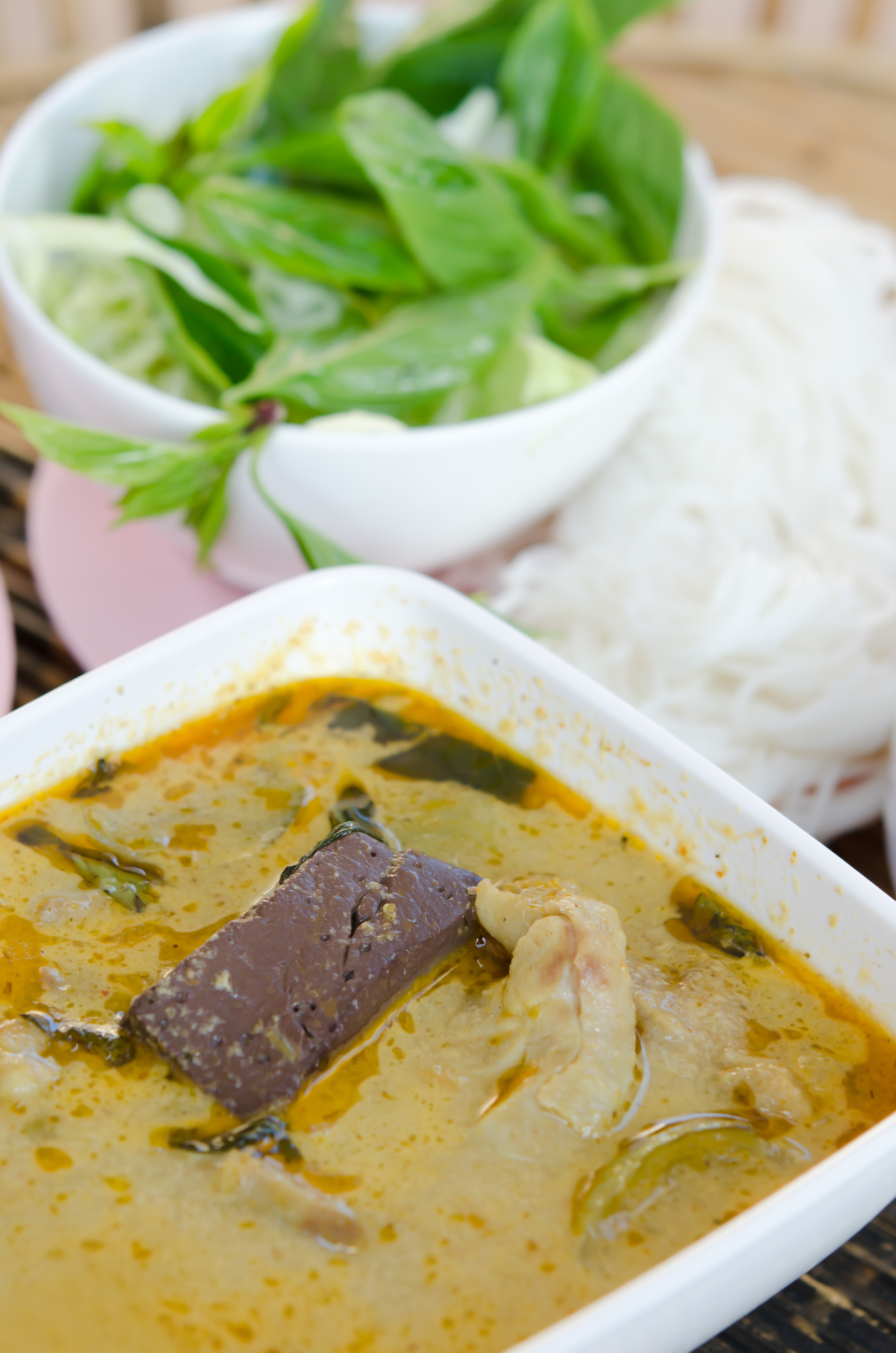 Overhead flat-lay of all ingredients for Sri Lankan Seer Fish Curry with Coconut Tamarind Broth laid out on a kitchen surface.